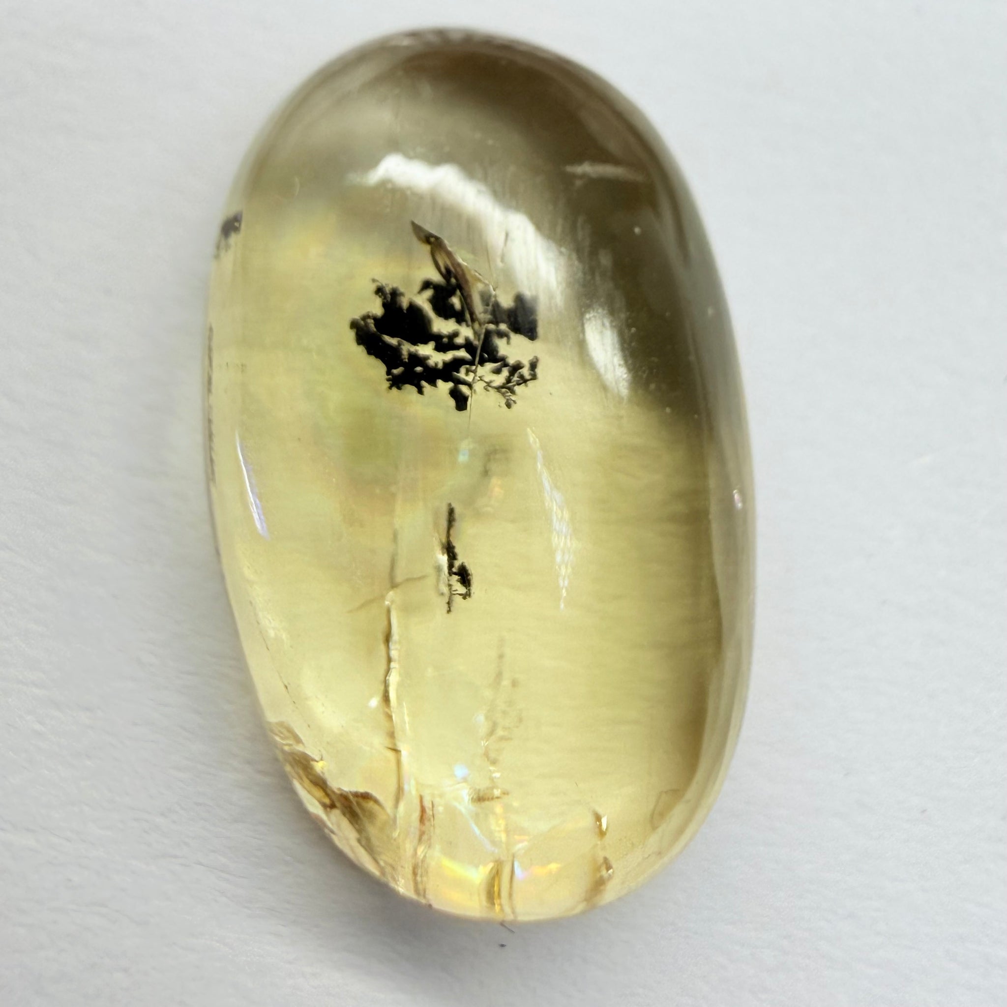 Golden Scapolite Cabochon with a dendrite, and a halo forming around the dendrite from a fracture, 11.53ct, Tanzania, Untreated Unheated