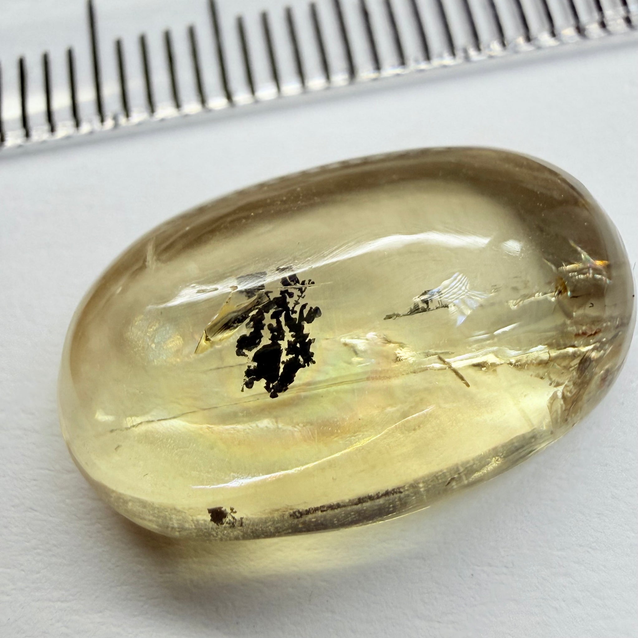Golden Scapolite Cabochon with a dendrite, and a halo forming around the dendrite from a fracture, 11.53ct, Tanzania, Untreated Unheated