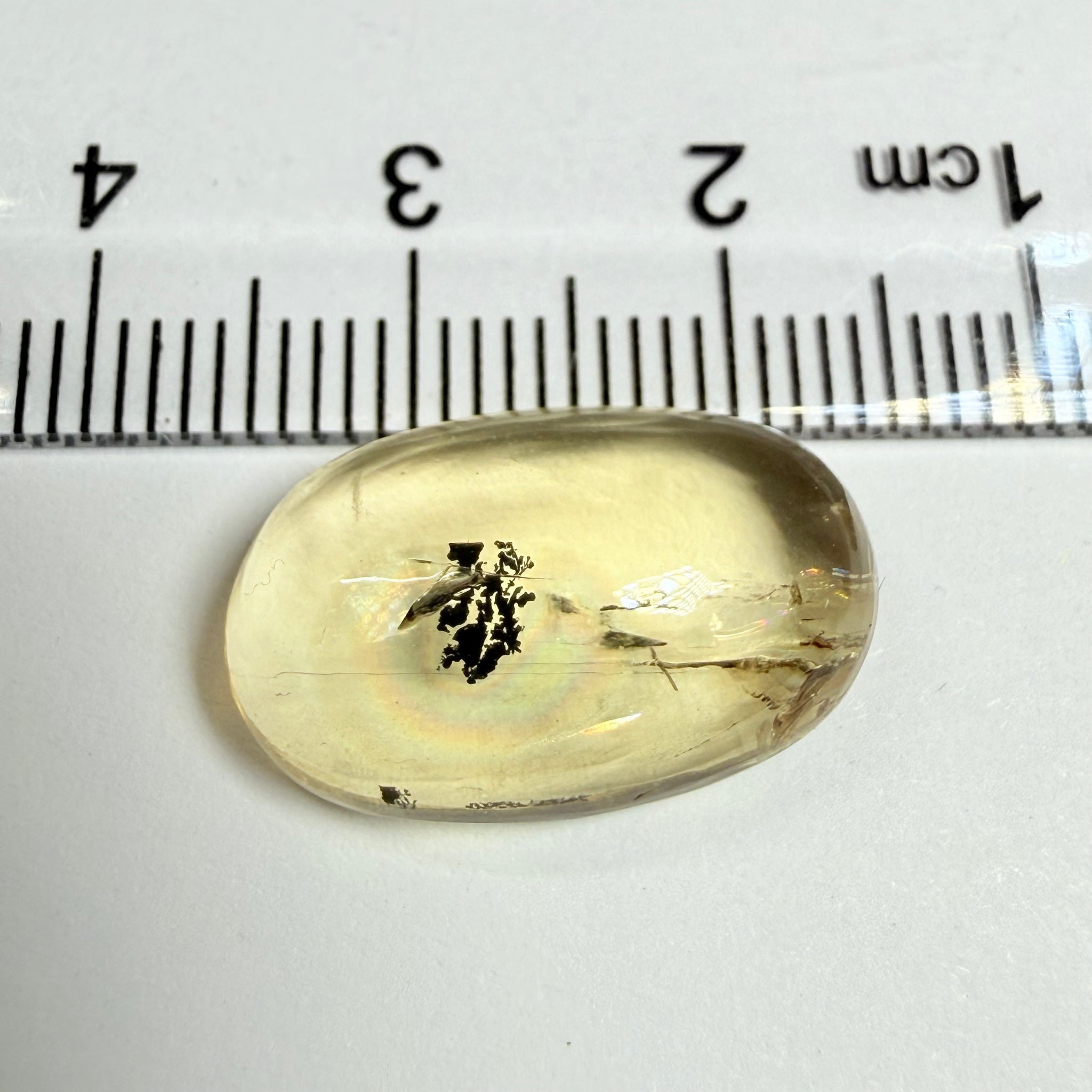 Golden Scapolite Cabochon with a dendrite, and a halo forming around the dendrite from a fracture, 11.53ct, Tanzania, Untreated Unheated
