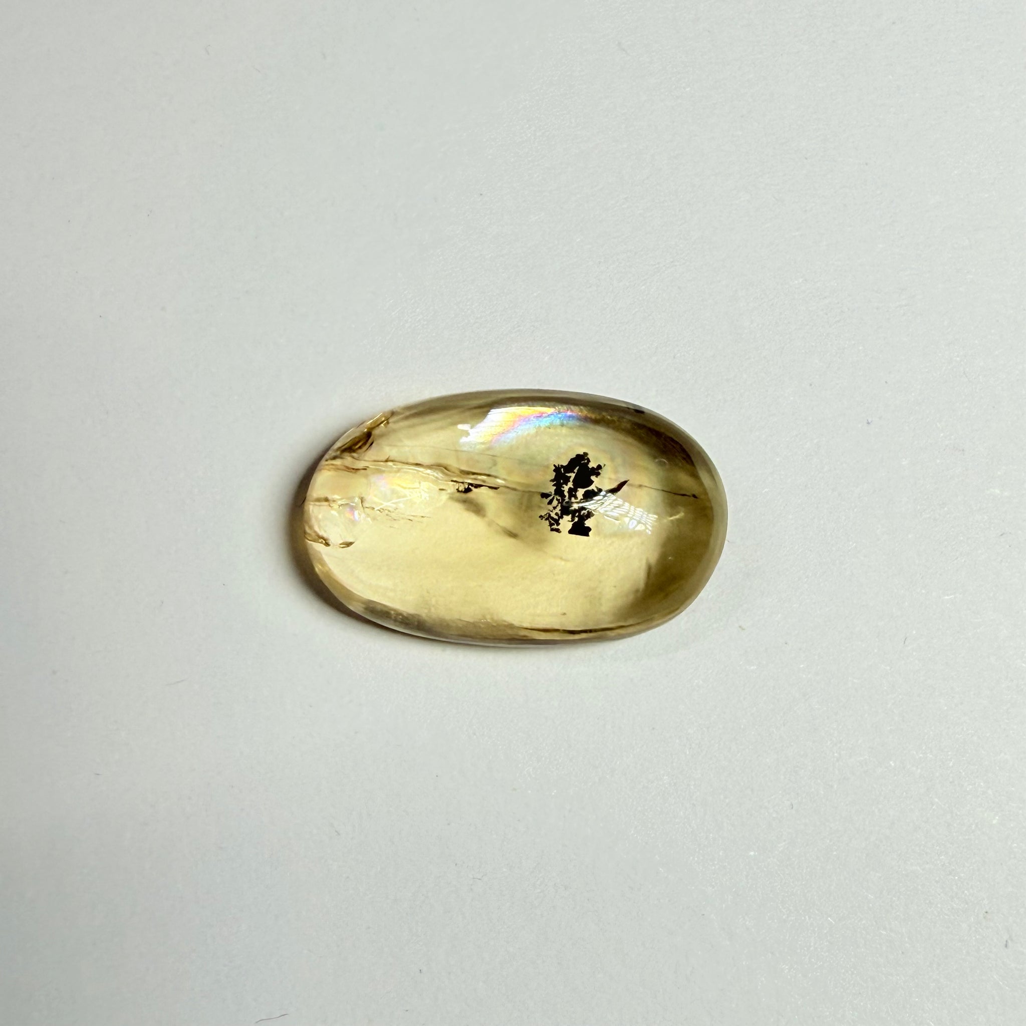 Golden Scapolite Cabochon with a dendrite, and a halo forming around the dendrite from a fracture, 11.53ct, Tanzania, Untreated Unheated