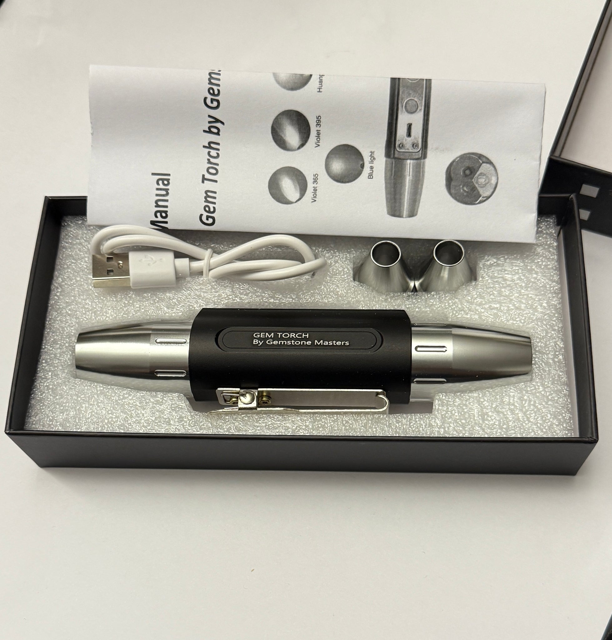 Gem Torch by Gemstone Masters, 6 function gem torch, strong power UV 365nm and 395nm, belt clip and 2 light focusing cones, 98% cri white bulb, 2-year warranty (excluding damage or wear and tear), we are the agents for this. Ships worldwide