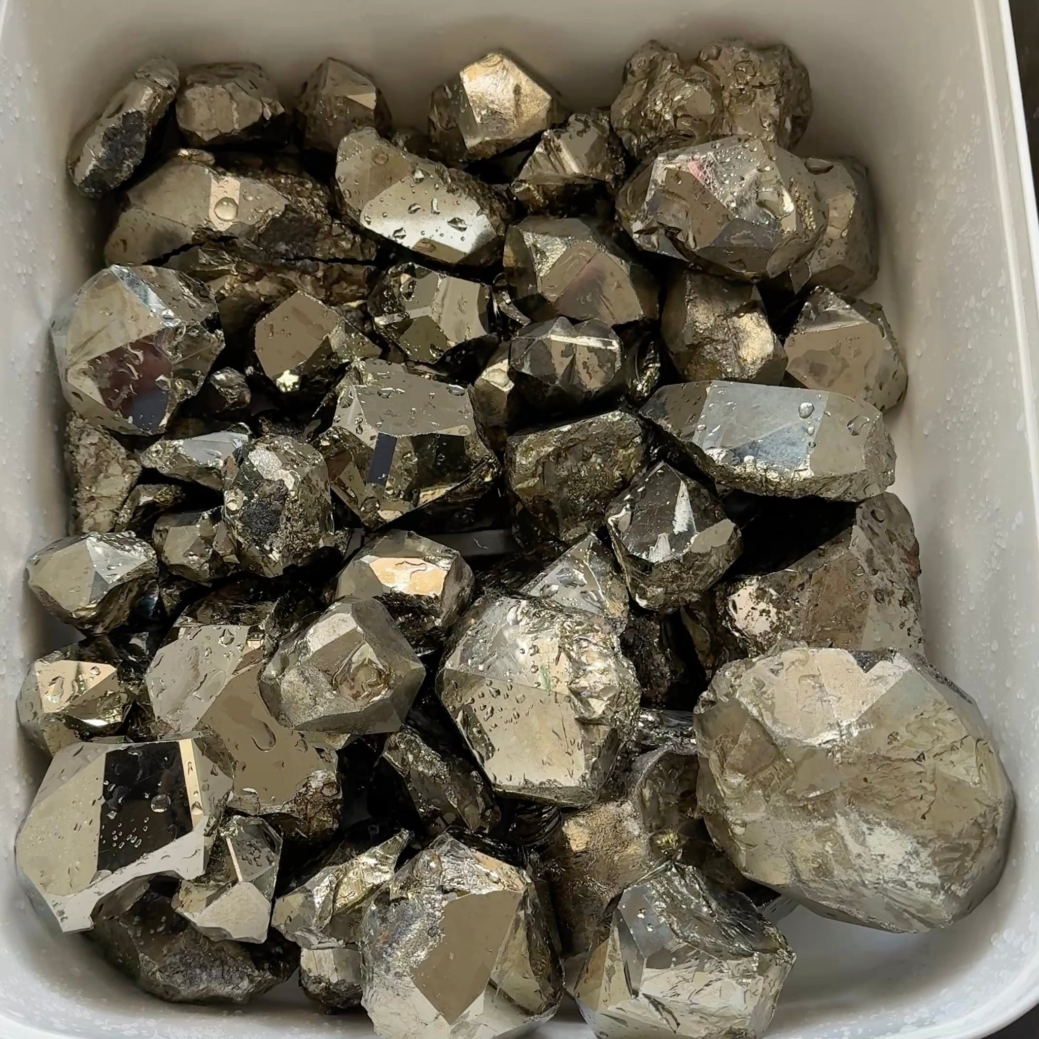 Mirror Shine Pyrite Lot from Merelani Tanzania. These that come from Merelani, show a high, natural mirror finish on the facets, without polishing, these have come out of the ground like this, shown wet, they can be faceted, the lot is 11.10 kilo