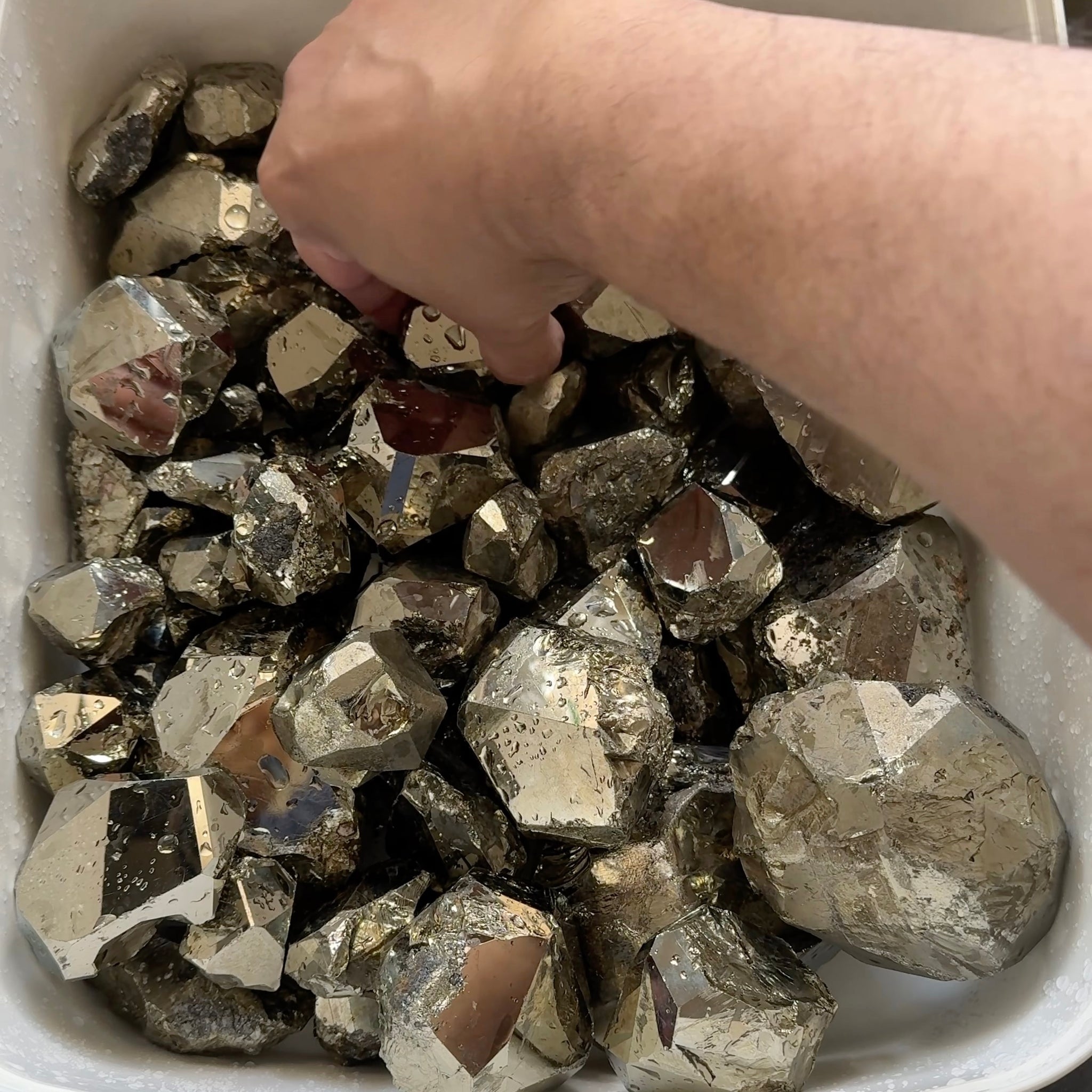 Mirror Shine Pyrite Lot from Merelani Tanzania. These that come from Merelani, show a high, natural mirror finish on the facets, without polishing, these have come out of the ground like this, shown wet, they can be faceted, the lot is 11.10 kilo
