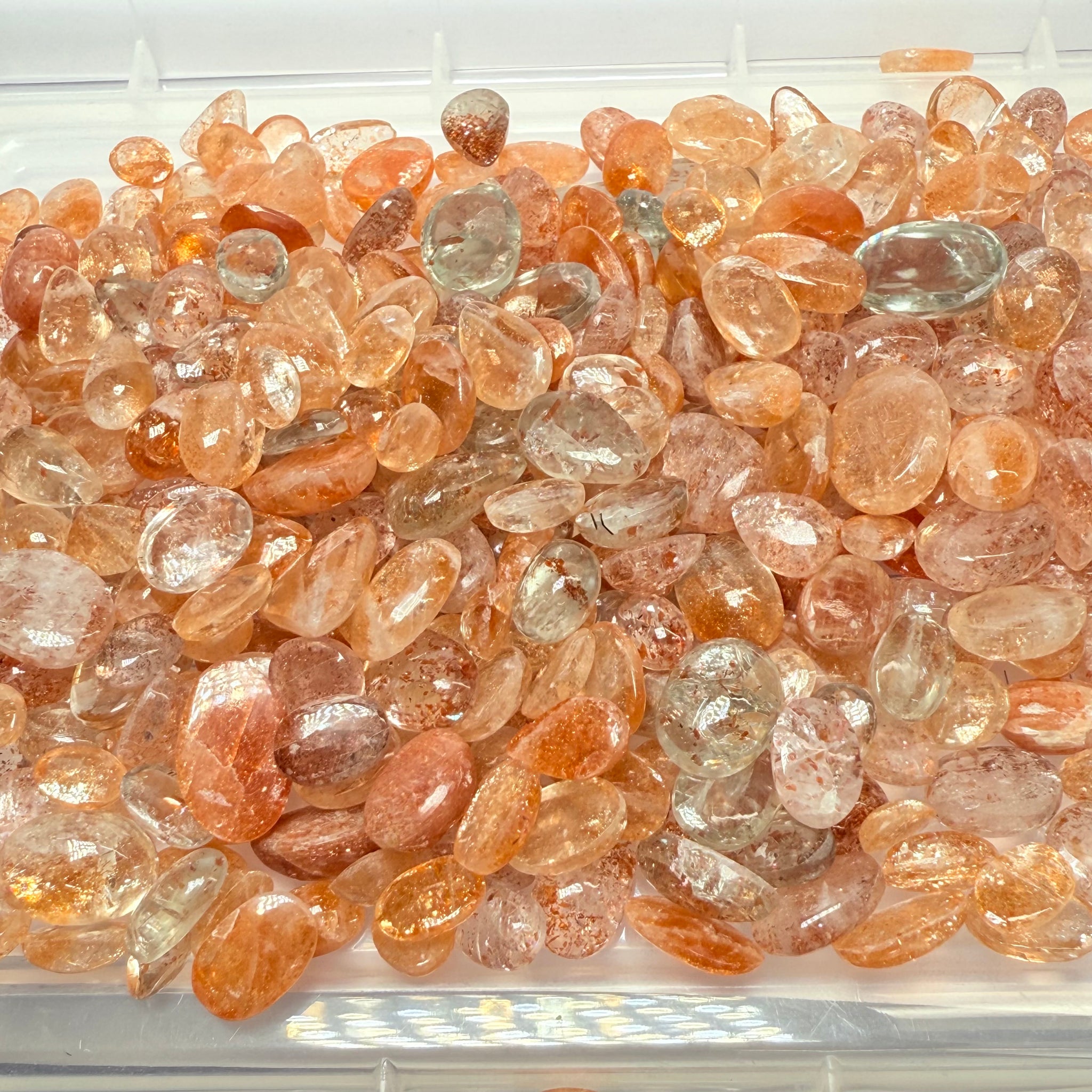Wholesale Sunstone Cab Lot, flat backed cabs, 228gm / 1140ct, Comminly called Maasai Confetti Sunstone, Tanzania, Untreated Unheated, photos and vids in different lights, see how they look
