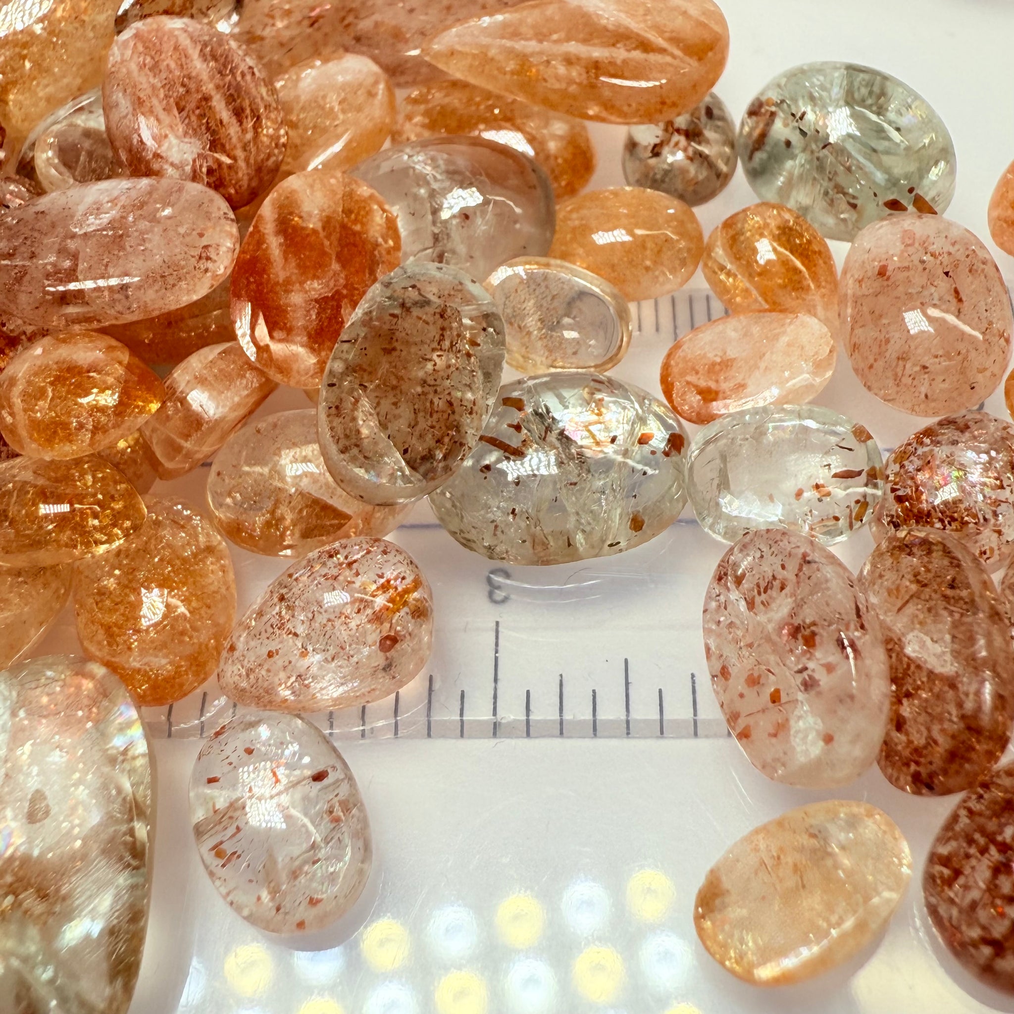 Wholesale Sunstone Cab Lot, flat backed cabs, 228gm / 1140ct, Comminly called Maasai Confetti Sunstone, Tanzania, Untreated Unheated, photos and vids in different lights, see how they look