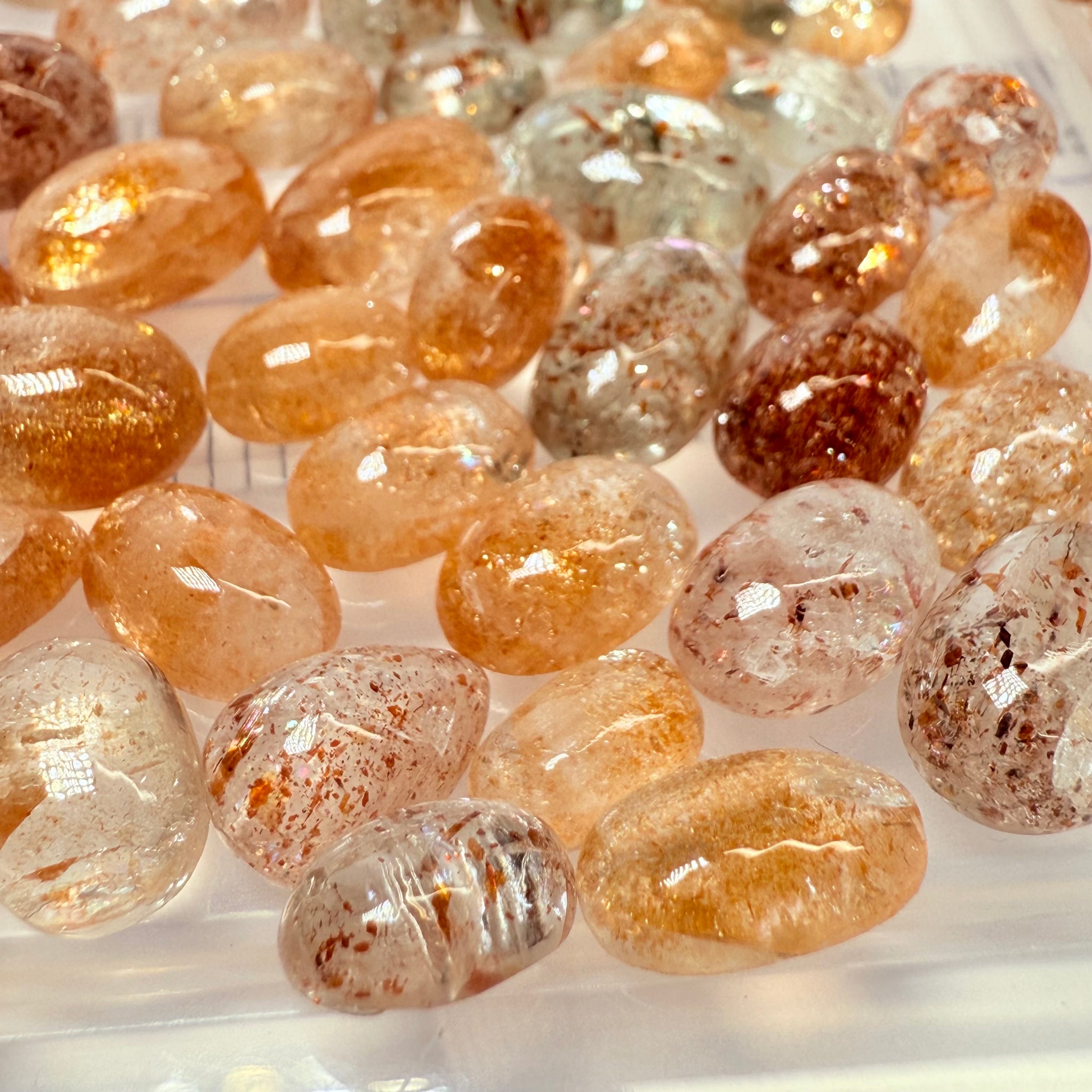 Wholesale Sunstone Cab Lot, flat backed cabs, 228gm / 1140ct, Comminly called Maasai Confetti Sunstone, Tanzania, Untreated Unheated, photos and vids in different lights, see how they look