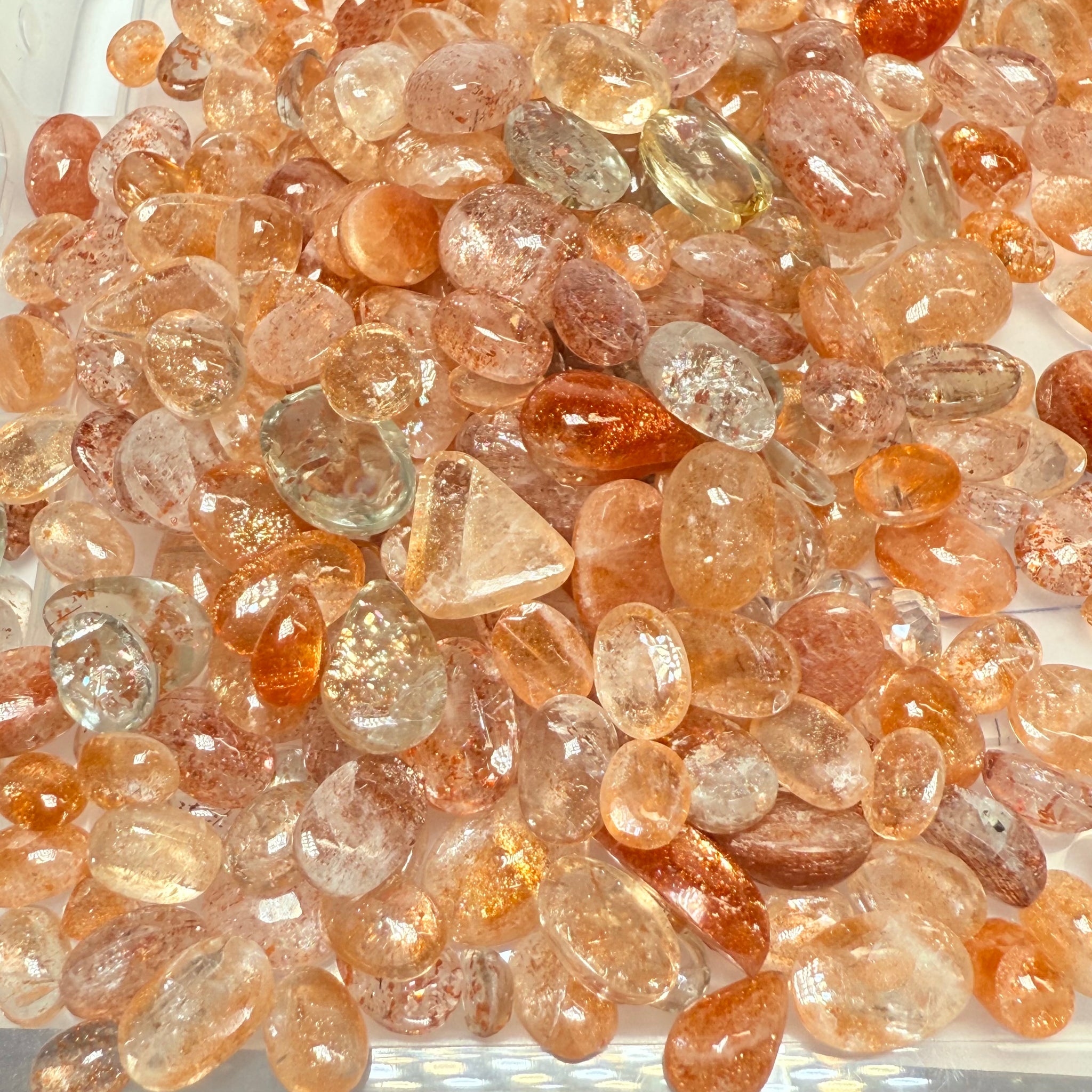 Wholesale Sunstone Cab Lot, flat backed cabs, 228gm / 1140ct, Comminly called Maasai Confetti Sunstone, Tanzania, Untreated Unheated, photos and vids in different lights, see how they look