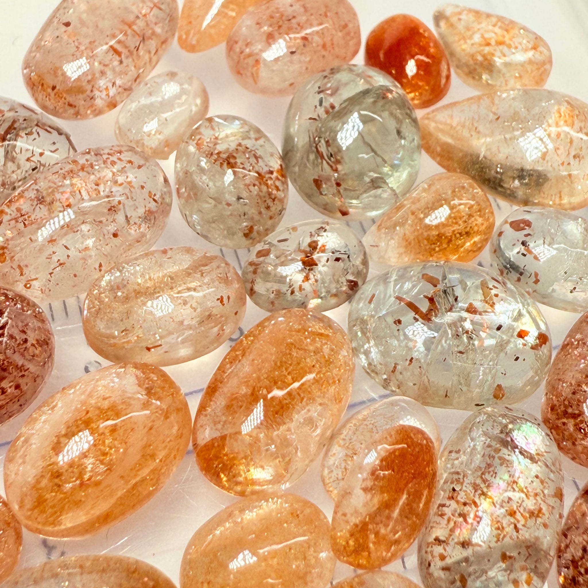 Wholesale Sunstone Cab Lot, flat backed cabs, 228gm / 1140ct, Comminly called Maasai Confetti Sunstone, Tanzania, Untreated Unheated, photos and vids in different lights, see how they look
