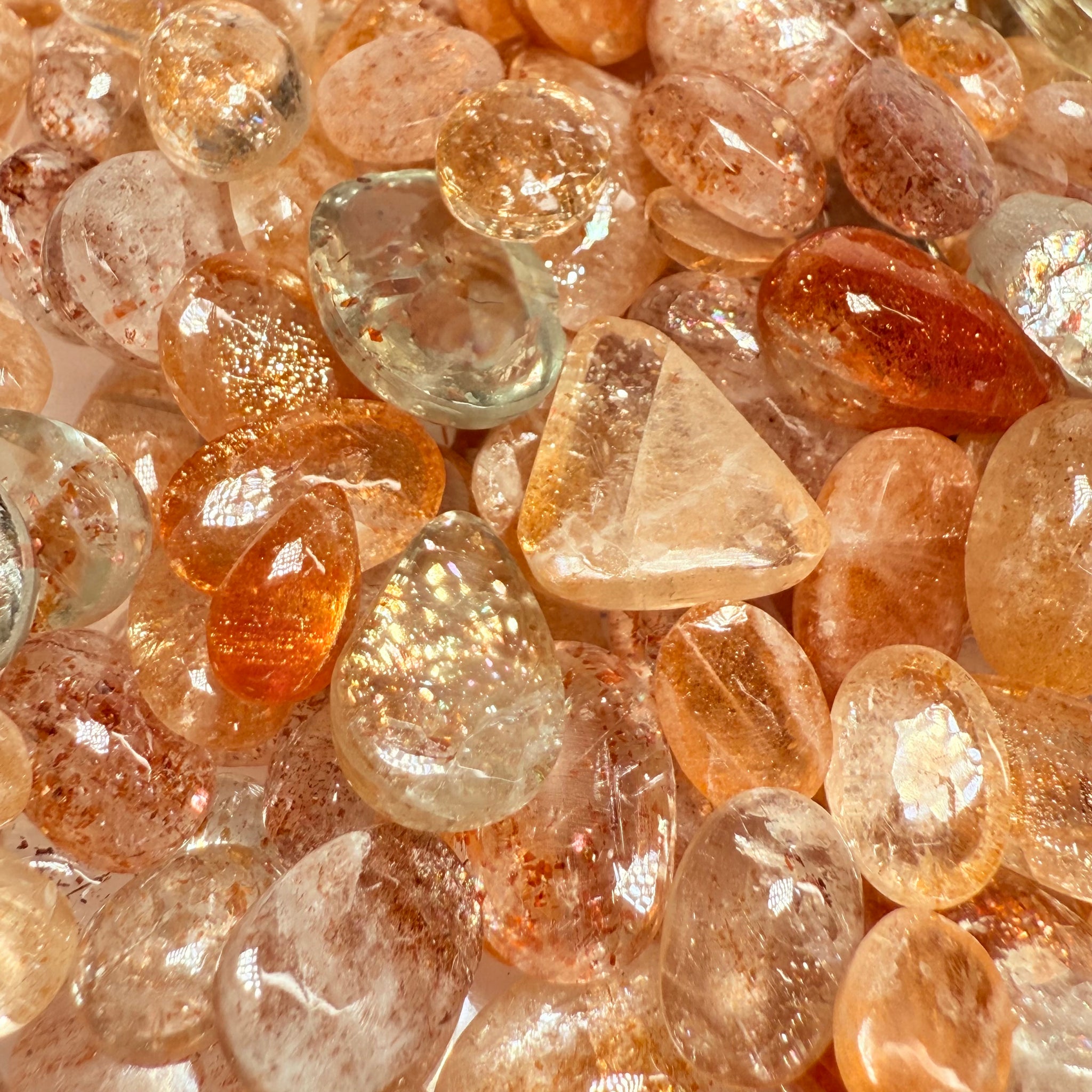 Wholesale Sunstone Cab Lot, flat backed cabs, 228gm / 1140ct, Comminly called Maasai Confetti Sunstone, Tanzania, Untreated Unheated, photos and vids in different lights, see how they look