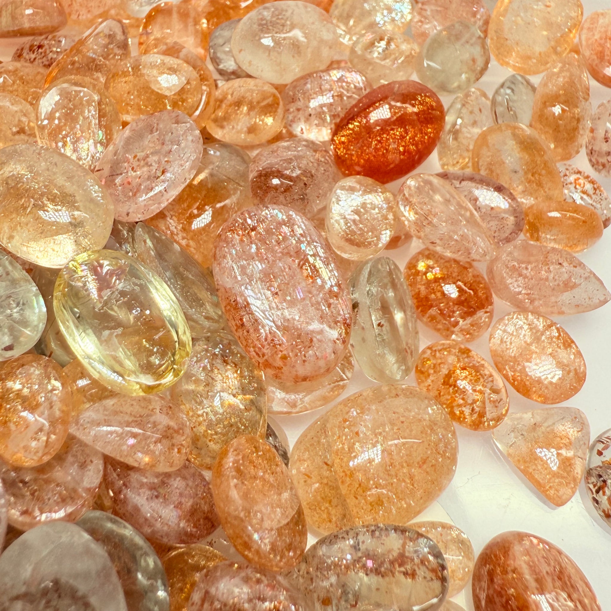 Wholesale Sunstone Cab Lot, flat backed cabs, 228gm / 1140ct, Comminly called Maasai Confetti Sunstone, Tanzania, Untreated Unheated, photos and vids in different lights, see how they look