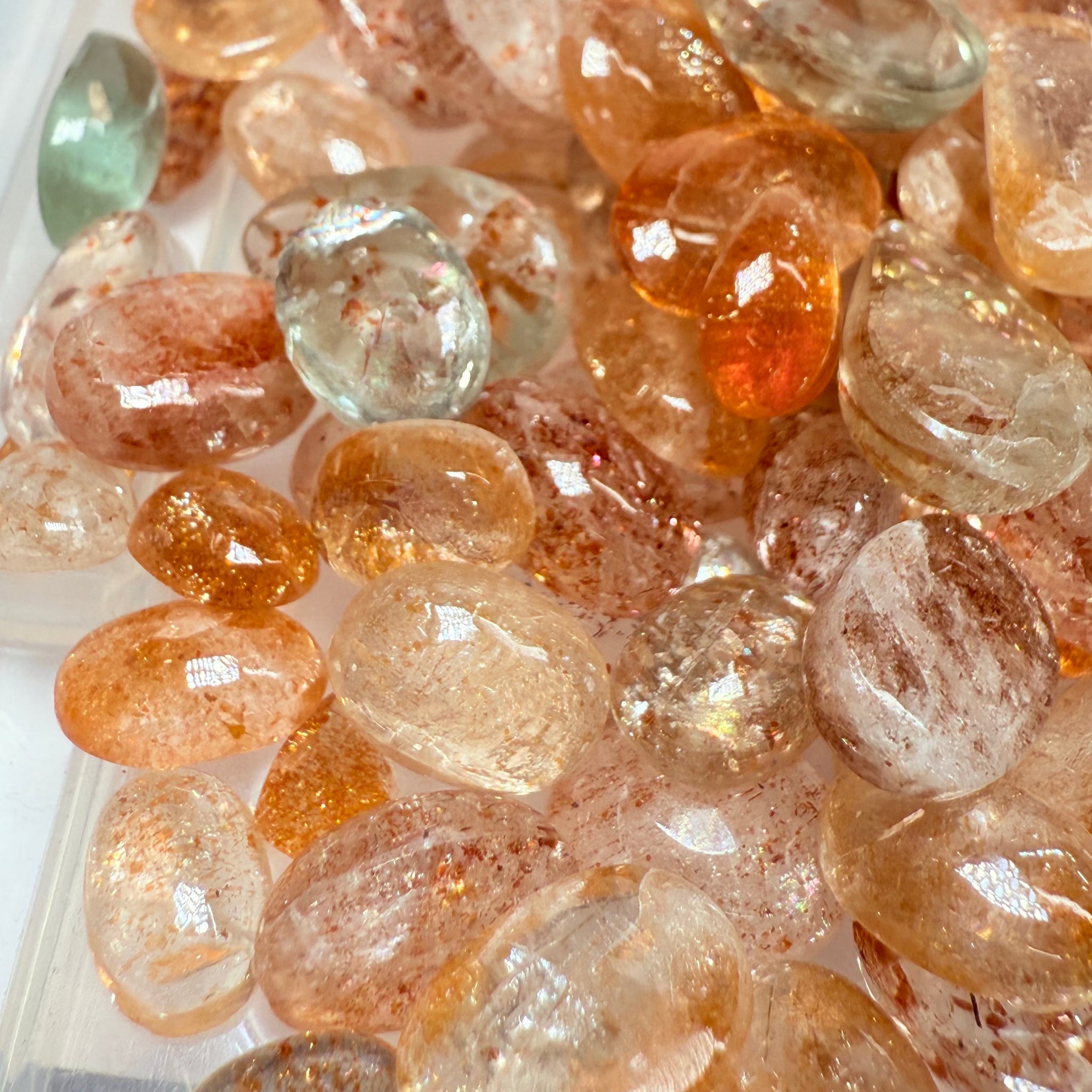 Wholesale Sunstone Cab Lot, flat backed cabs, 228gm / 1140ct, Comminly called Maasai Confetti Sunstone, Tanzania, Untreated Unheated, photos and vids in different lights, see how they look
