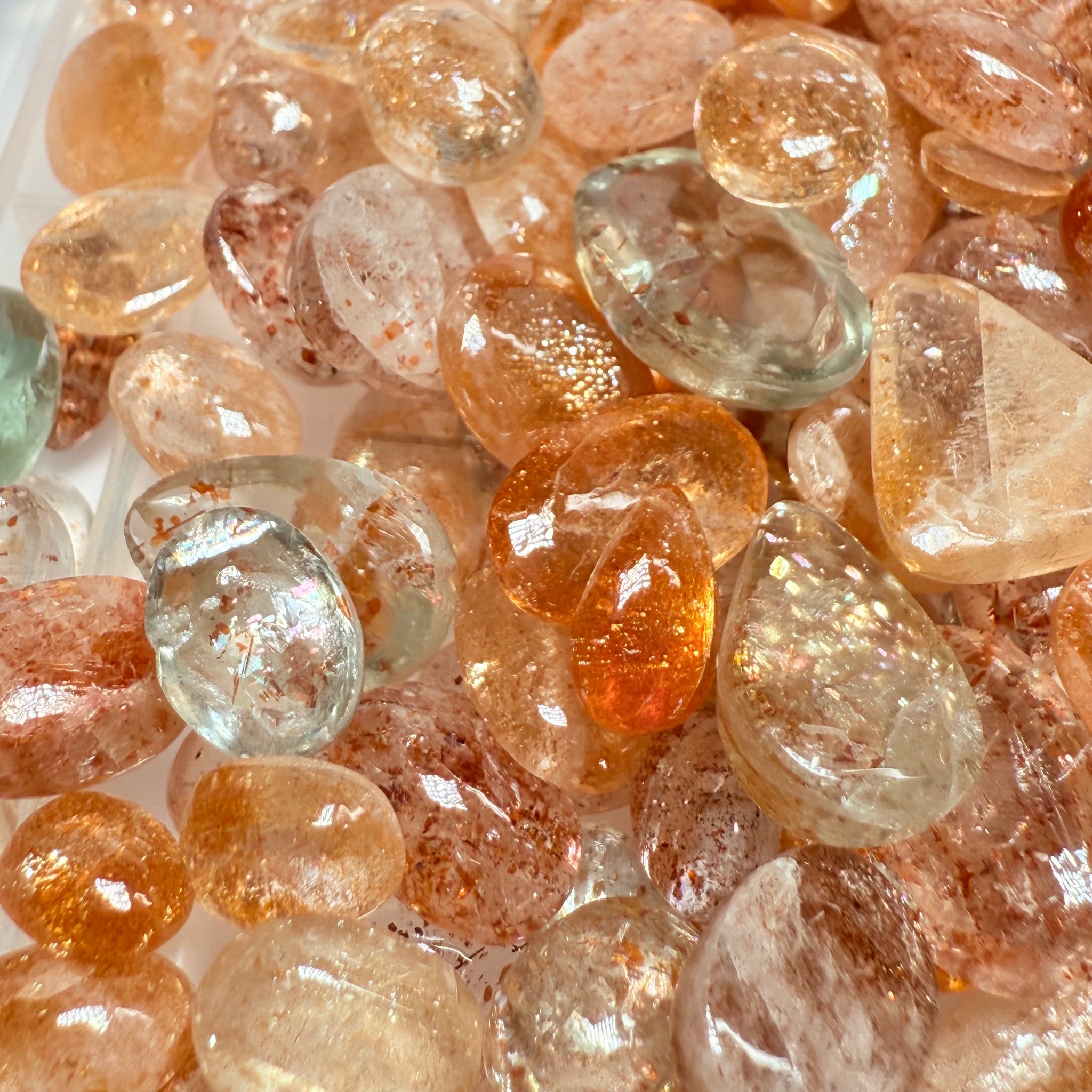 Wholesale Sunstone Cab Lot, flat backed cabs, 228gm / 1140ct, Comminly called Maasai Confetti Sunstone, Tanzania, Untreated Unheated, photos and vids in different lights, see how they look
