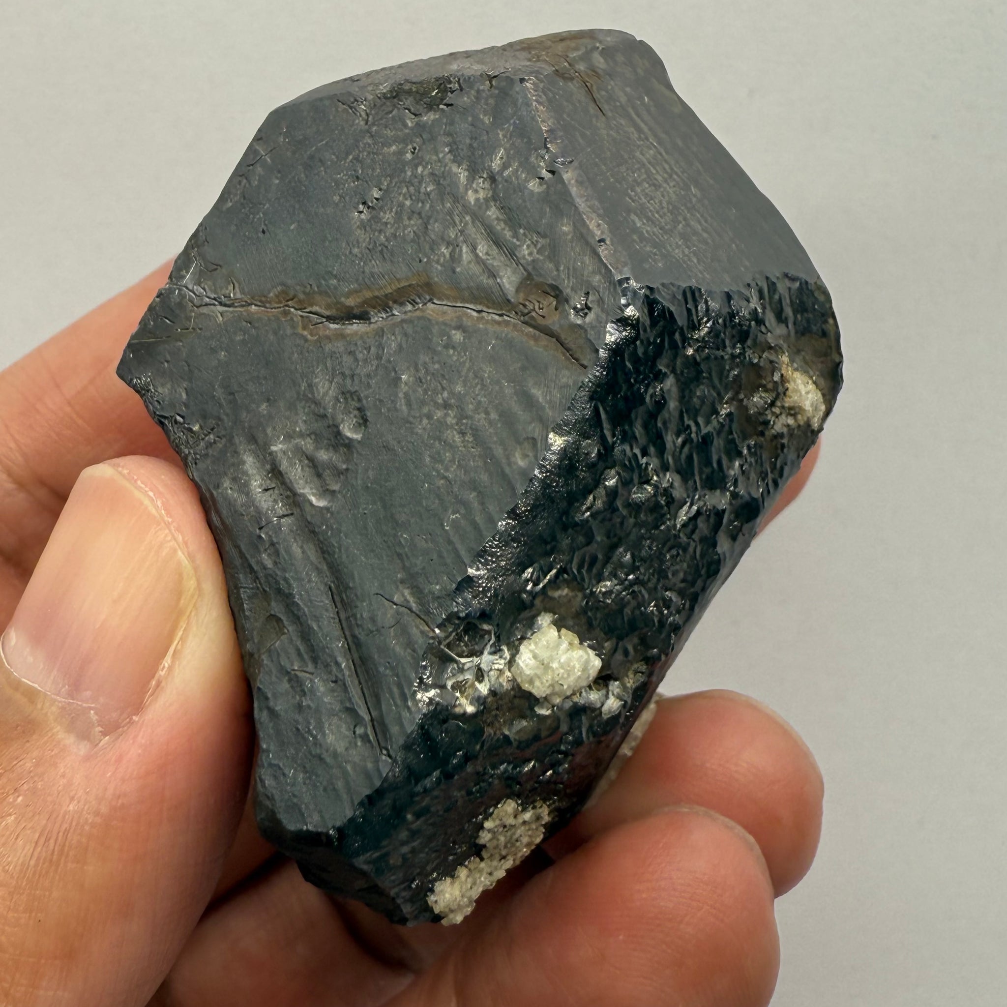 Alabandite Crystal, Merelani, same mining pit as Tanzanite, comes out with Tanzanite, Tanzania, Untreated Unheated. 140.9gm 56.6 x 36.2 x 46.4 mm