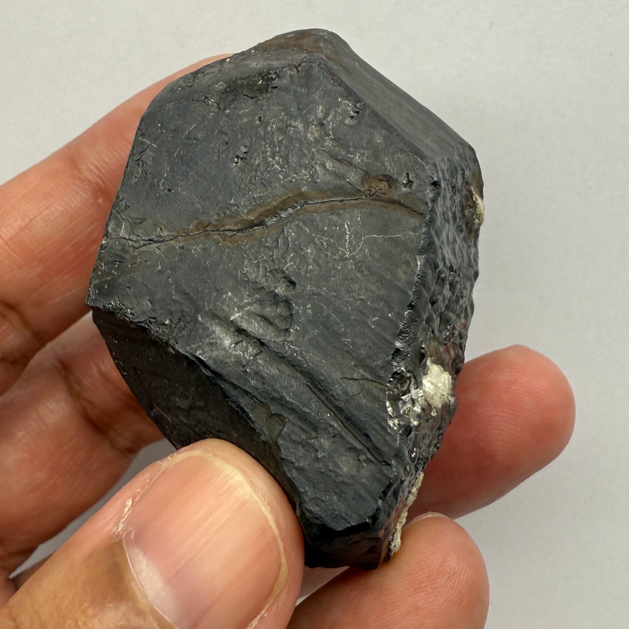 Alabandite Crystal, Merelani, same mining pit as Tanzanite, comes out with Tanzanite, Tanzania, Untreated Unheated. 140.9gm 56.6 x 36.2 x 46.4 mm