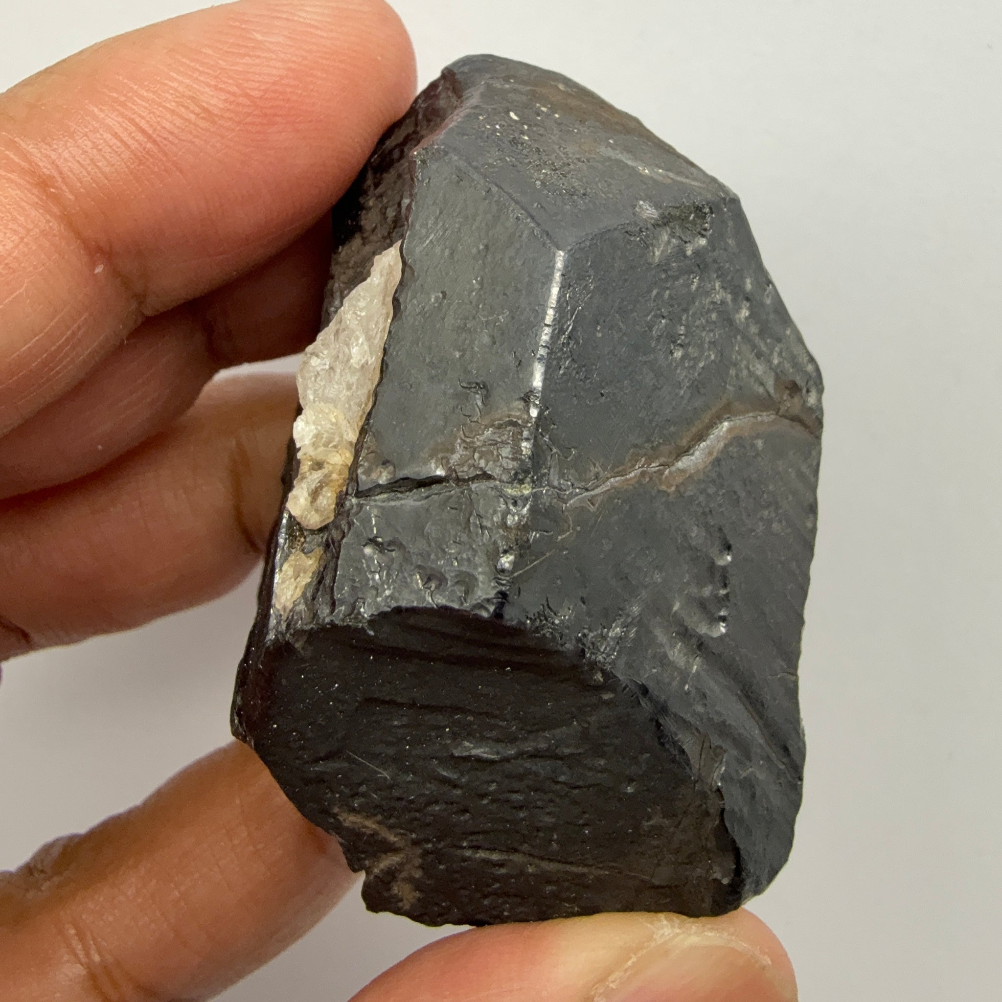 Alabandite Crystal, Merelani, same mining pit as Tanzanite, comes out with Tanzanite, Tanzania, Untreated Unheated. 140.9gm 56.6 x 36.2 x 46.4 mm