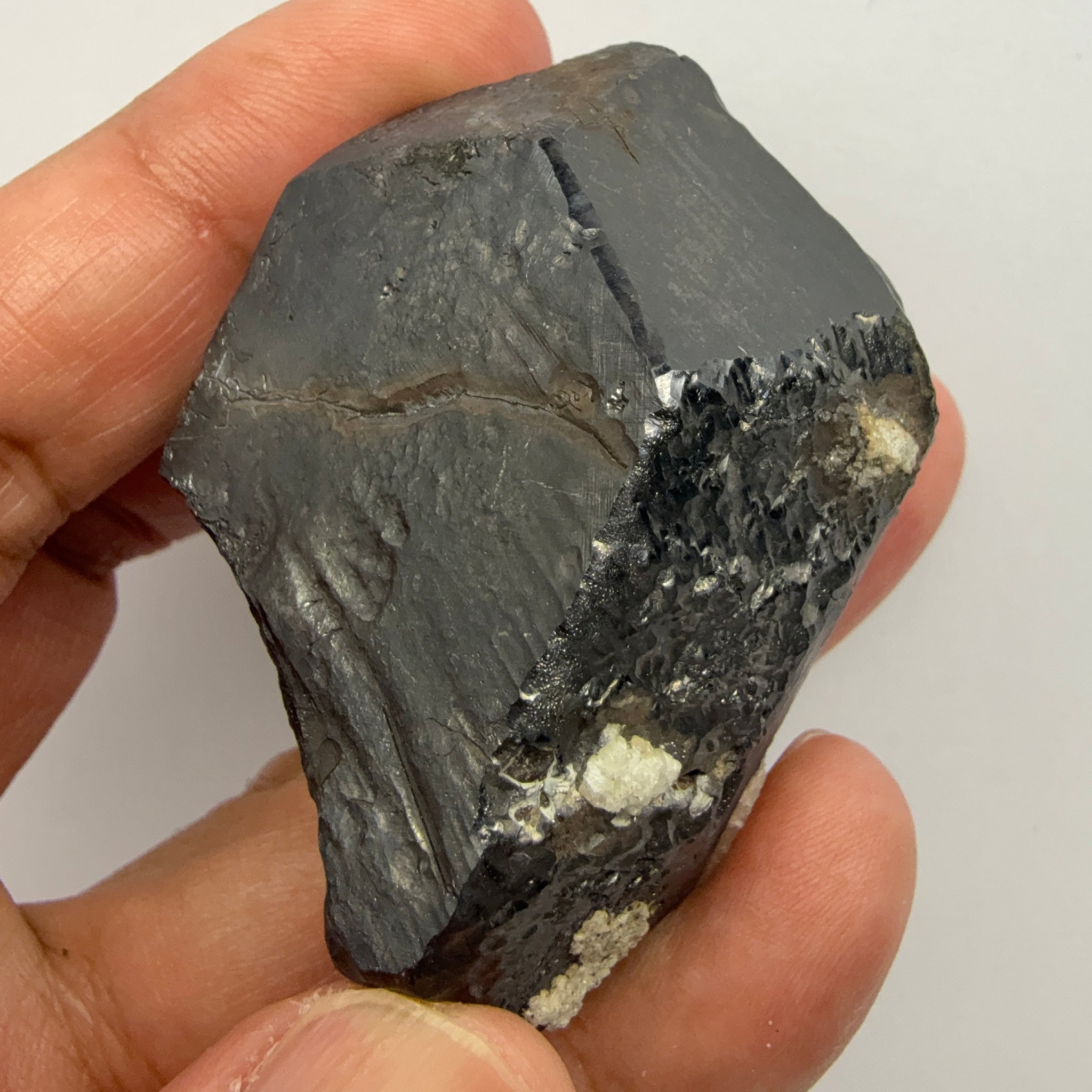 Alabandite Crystal, Merelani, same mining pit as Tanzanite, comes out with Tanzanite, Tanzania, Untreated Unheated. 140.9gm 56.6 x 36.2 x 46.4 mm