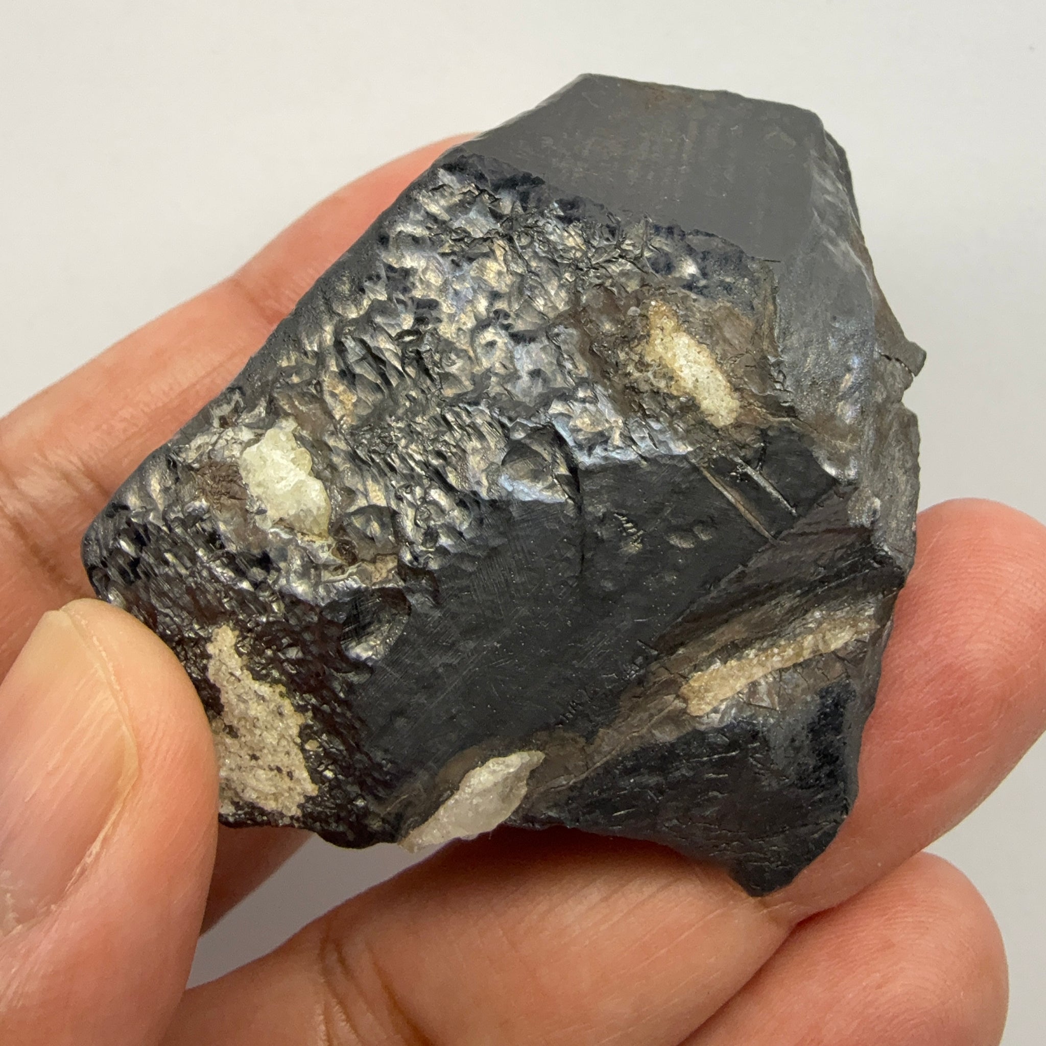 Alabandite Crystal, Merelani, same mining pit as Tanzanite, comes out with Tanzanite, Tanzania, Untreated Unheated. 140.9gm 56.6 x 36.2 x 46.4 mm