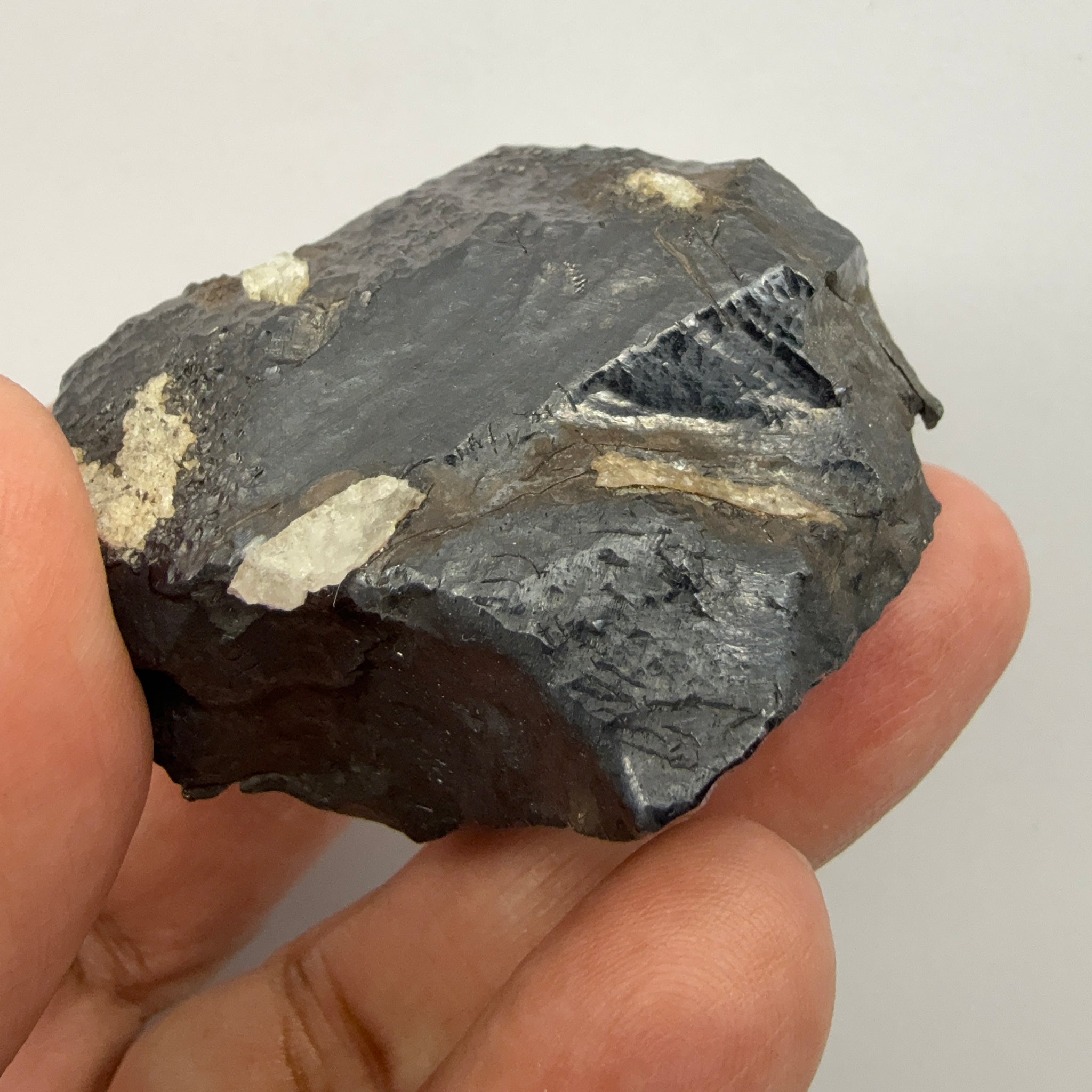 Alabandite Crystal, Merelani, same mining pit as Tanzanite, comes out with Tanzanite, Tanzania, Untreated Unheated. 140.9gm 56.6 x 36.2 x 46.4 mm