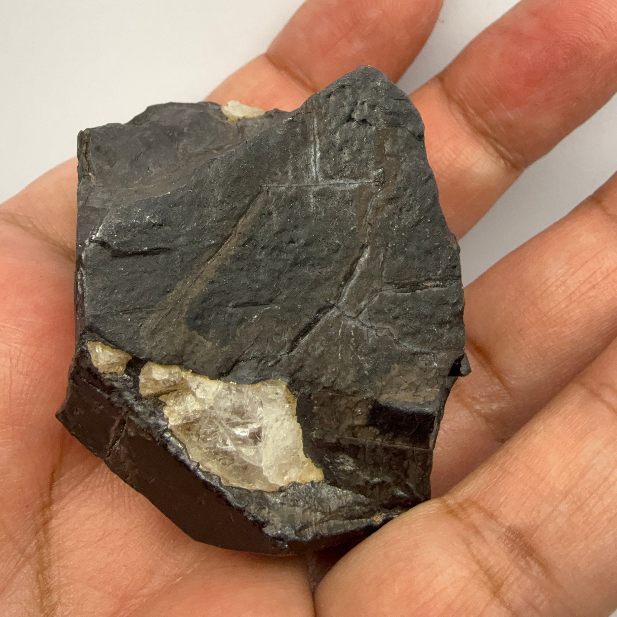 Alabandite Crystal, Merelani, same mining pit as Tanzanite, comes out with Tanzanite, Tanzania, Untreated Unheated. 140.9gm 56.6 x 36.2 x 46.4 mm