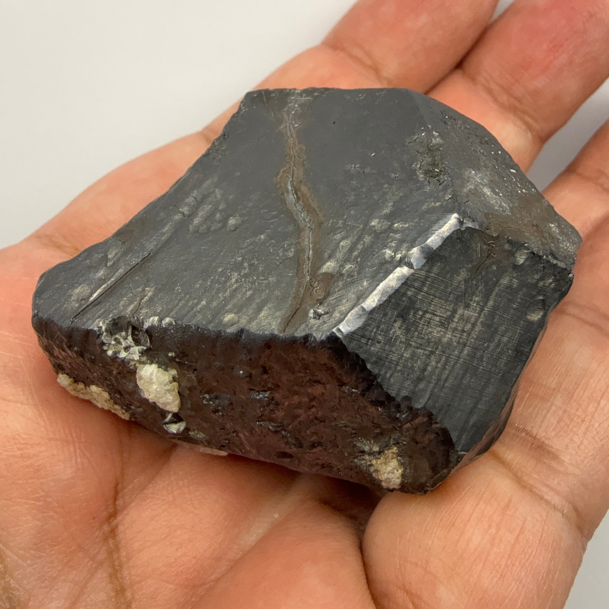 Alabandite Crystal, Merelani, same mining pit as Tanzanite, comes out with Tanzanite, Tanzania, Untreated Unheated. 140.9gm 56.6 x 36.2 x 46.4 mm