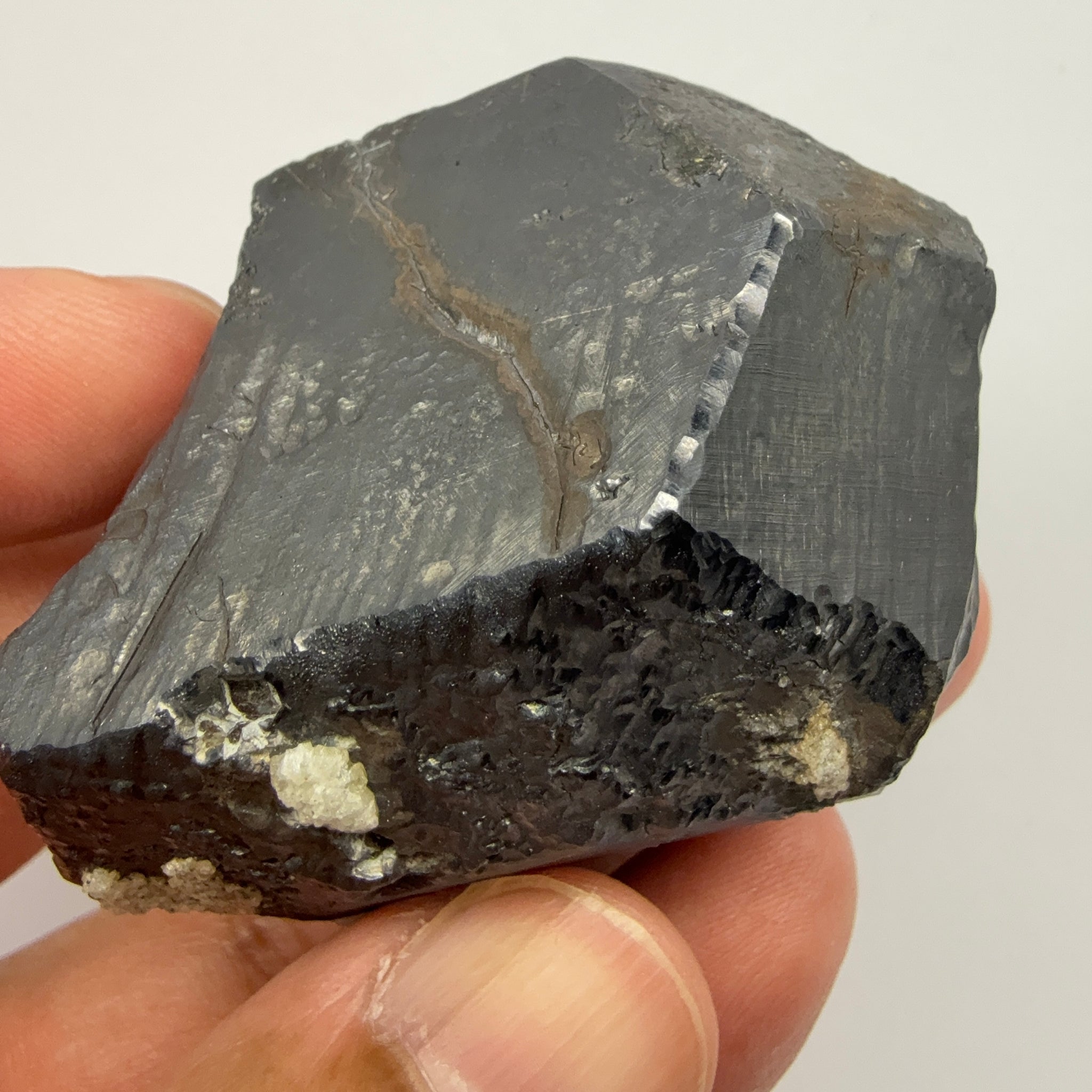 Alabandite Crystal, Merelani, same mining pit as Tanzanite, comes out with Tanzanite, Tanzania, Untreated Unheated. 140.9gm 56.6 x 36.2 x 46.4 mm