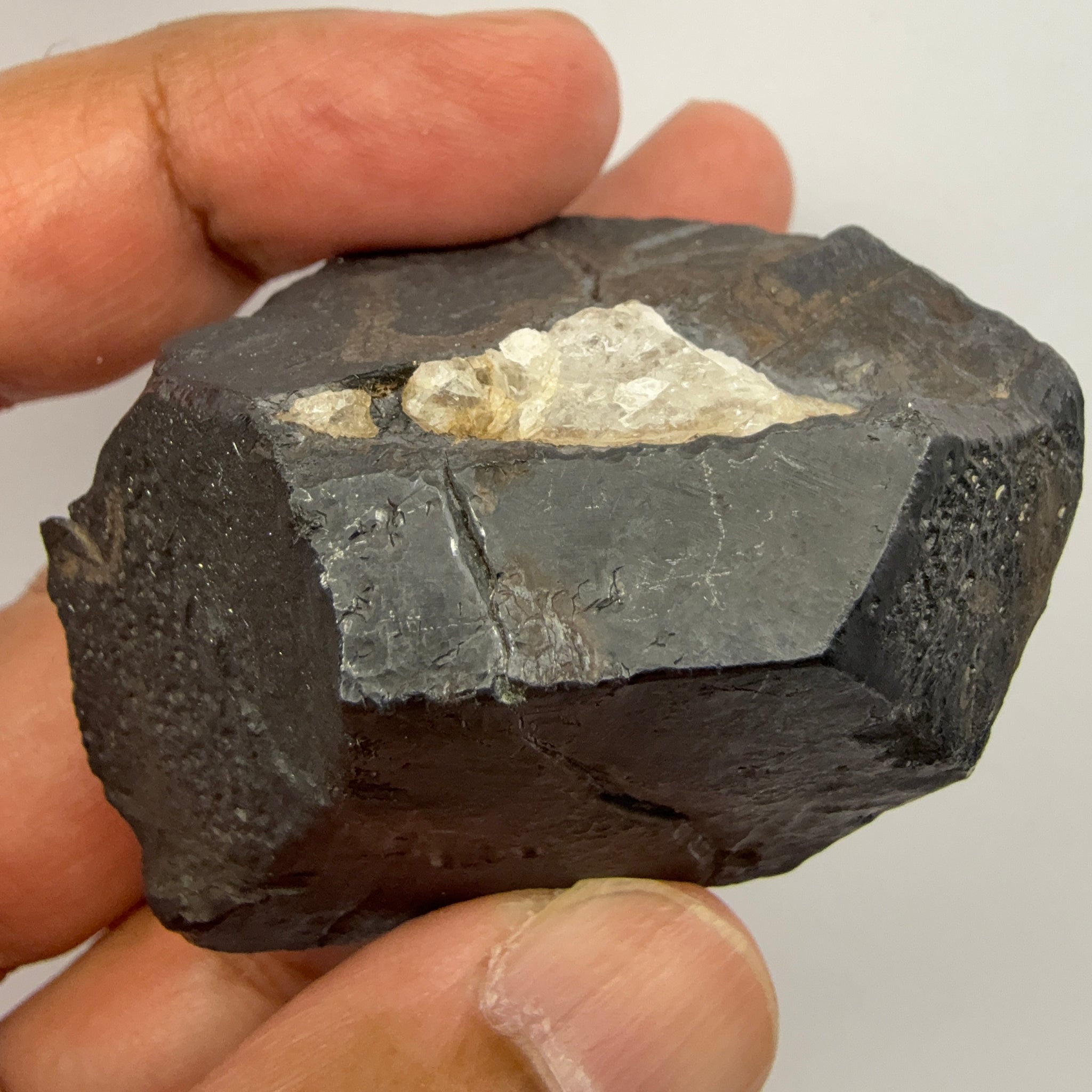 Alabandite Crystal, Merelani, same mining pit as Tanzanite, comes out with Tanzanite, Tanzania, Untreated Unheated. 140.9gm 56.6 x 36.2 x 46.4 mm