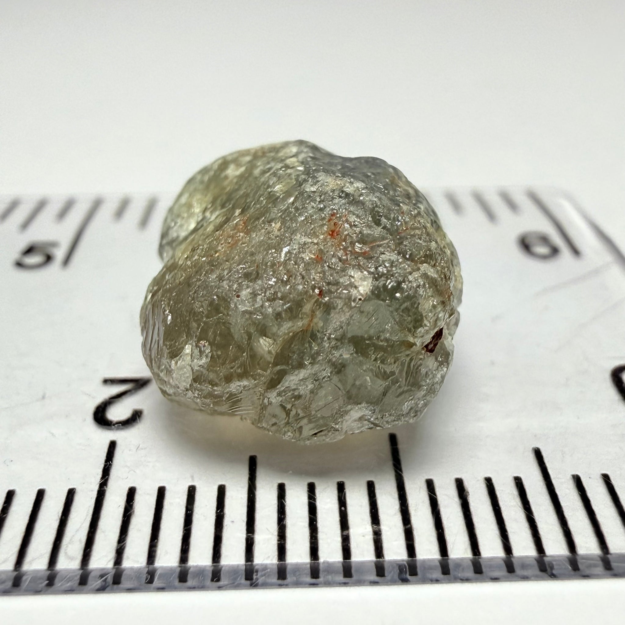 Umba Sapphire, 14.72ct, Umba Valley, Tanzania, Untreated Unheated. Slightly to moderately included,  slight silk, crack going a 1/4 way in. See the backlit pics  I have circled the crack, minor fissures to be removed before faceting