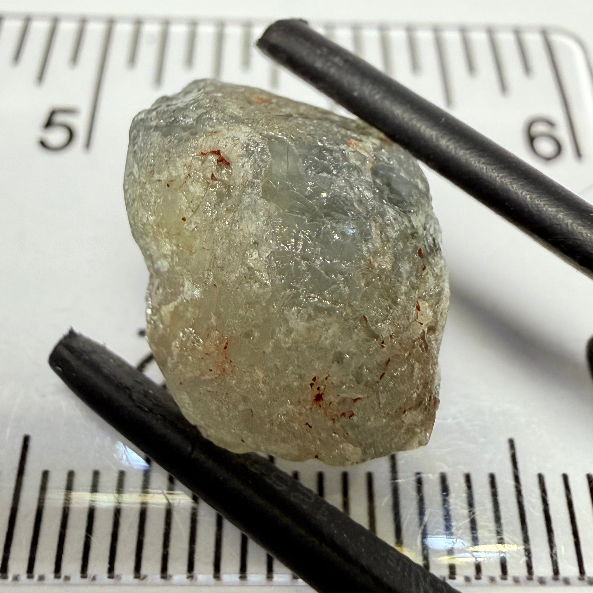 Umba Sapphire, 14.72ct, Umba Valley, Tanzania, Untreated Unheated. Slightly to moderately included,  slight silk, crack going a 1/4 way in. See the backlit pics  I have circled the crack, minor fissures to be removed before faceting