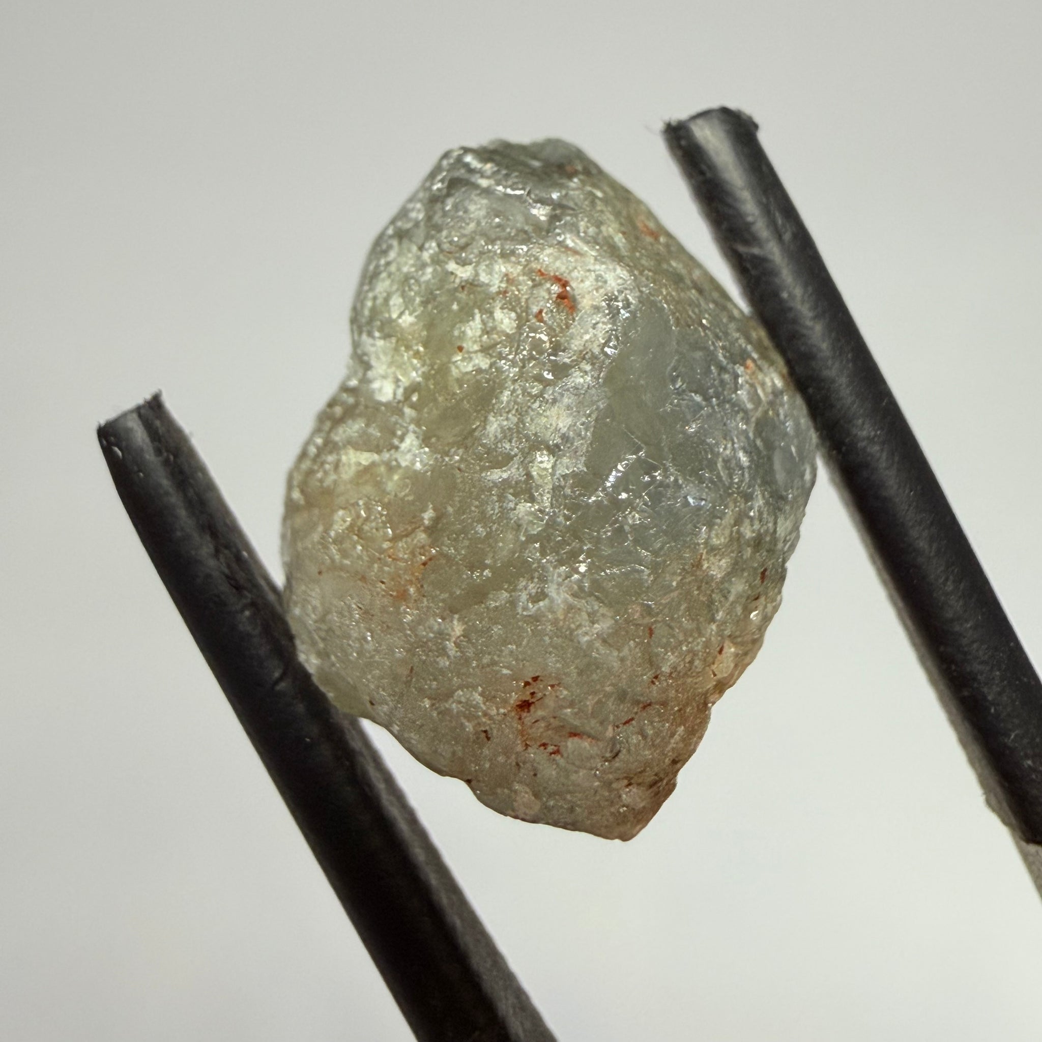 Umba Sapphire, 14.72ct, Umba Valley, Tanzania, Untreated Unheated. Slightly to moderately included,  slight silk, crack going a 1/4 way in. See the backlit pics  I have circled the crack, minor fissures to be removed before faceting