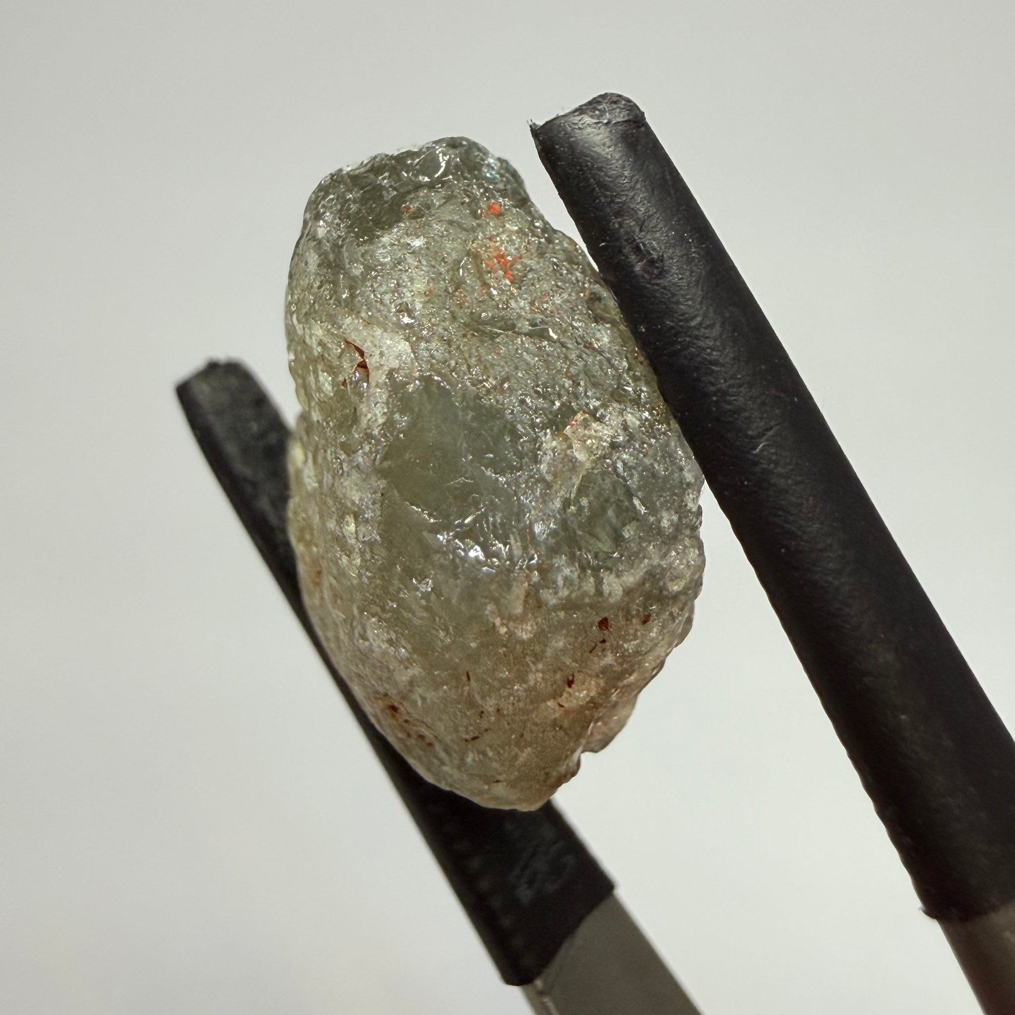 Umba Sapphire, 14.72ct, Umba Valley, Tanzania, Untreated Unheated. Slightly to moderately included,  slight silk, crack going a 1/4 way in. See the backlit pics  I have circled the crack, minor fissures to be removed before faceting