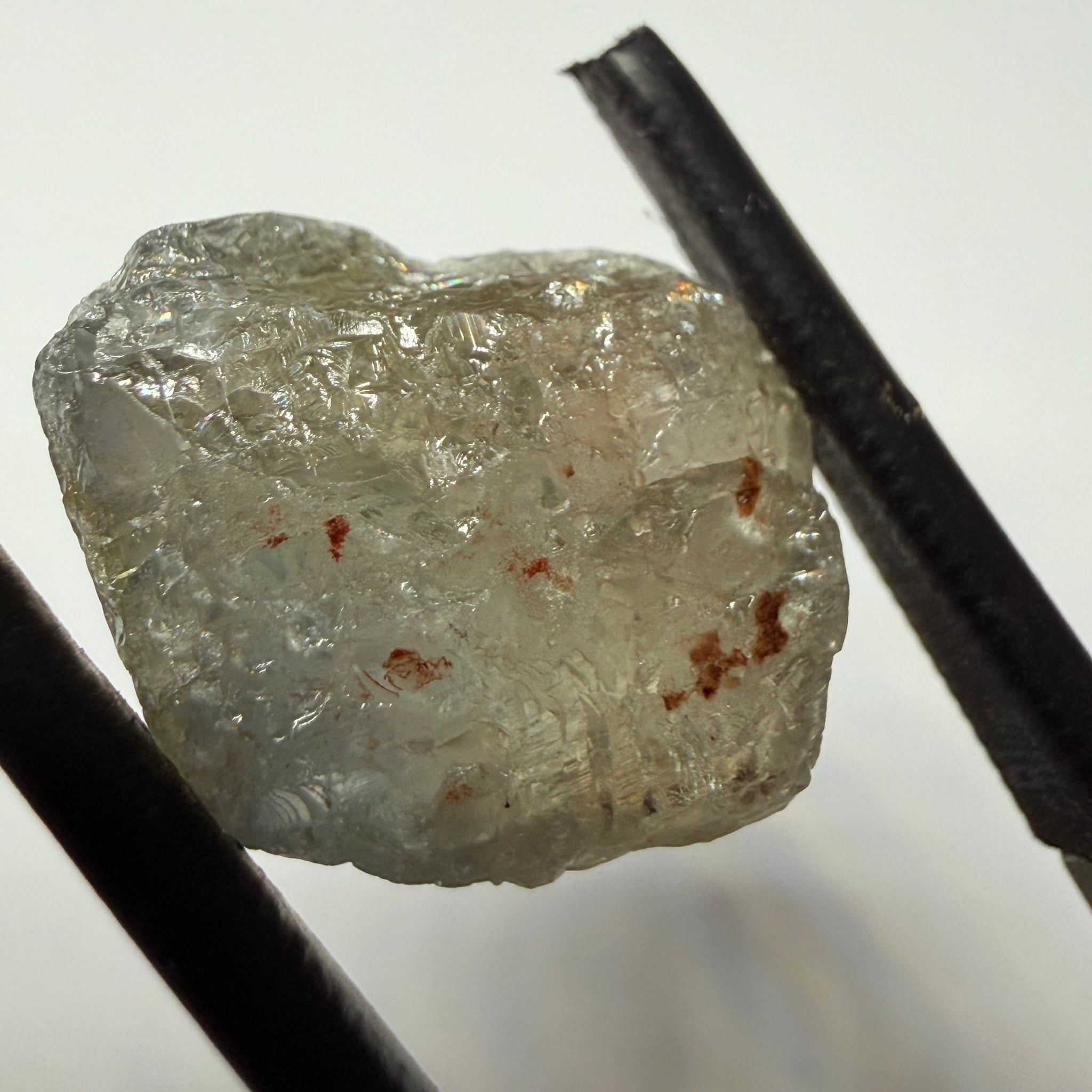 Umba Sapphire, 14.72ct, Umba Valley, Tanzania, Untreated Unheated. Slightly to moderately included,  slight silk, crack going a 1/4 way in. See the backlit pics  I have circled the crack, minor fissures to be removed before faceting