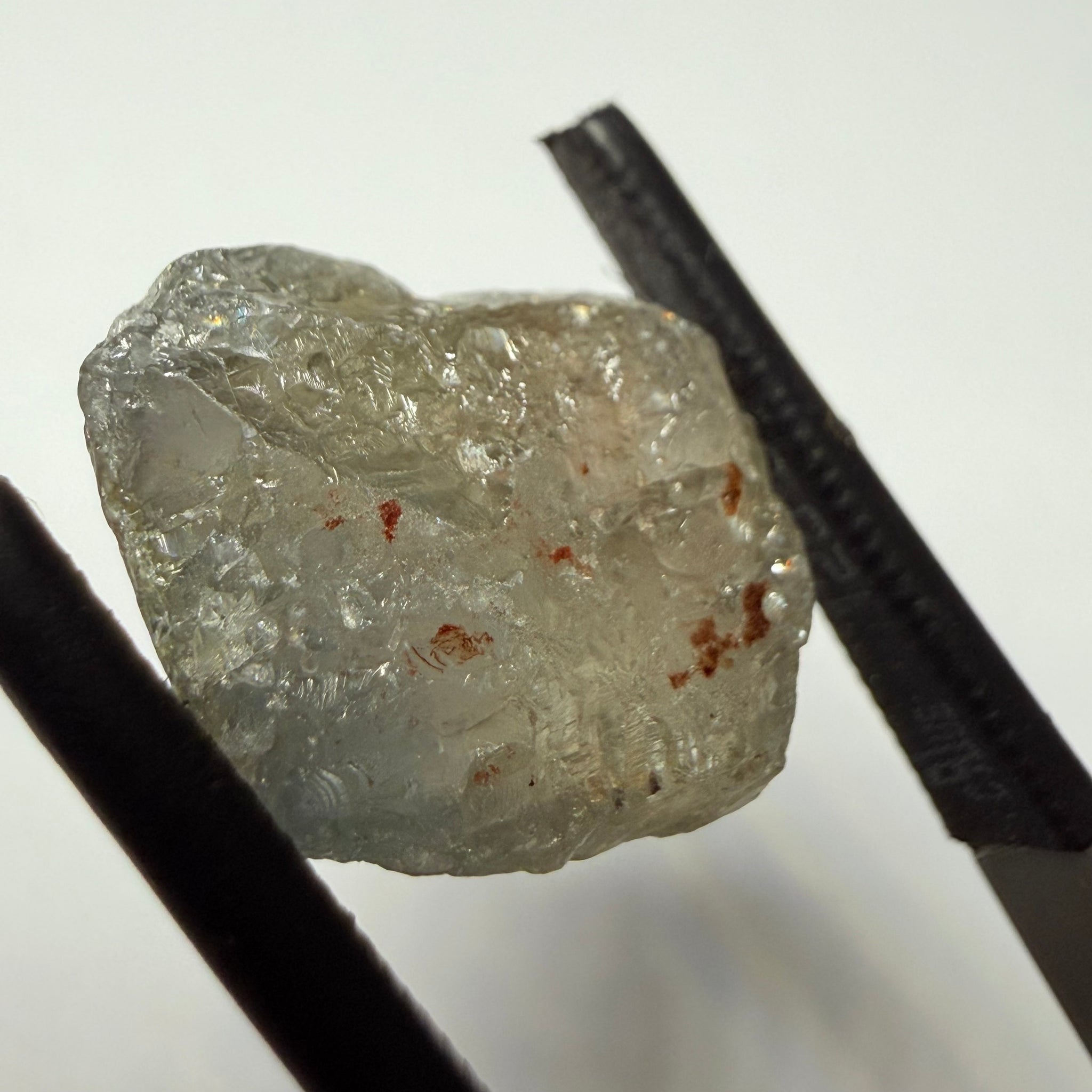 Umba Sapphire, 14.72ct, Umba Valley, Tanzania, Untreated Unheated. Slightly to moderately included,  slight silk, crack going a 1/4 way in. See the backlit pics  I have circled the crack, minor fissures to be removed before faceting