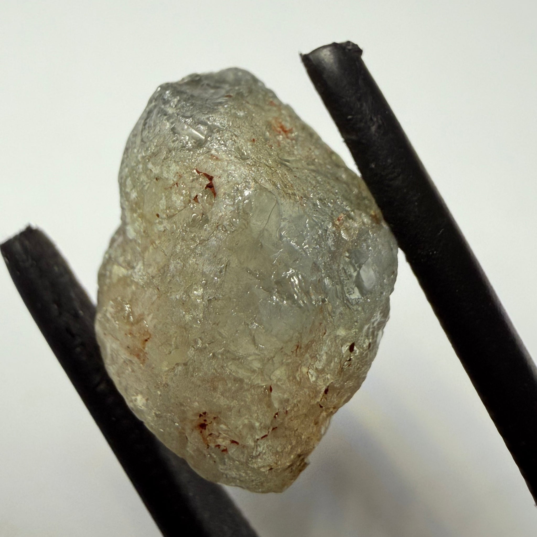 Umba Sapphire, 14.72ct, Umba Valley, Tanzania, Untreated Unheated. Slightly to moderately included,  slight silk, crack going a 1/4 way in. See the backlit pics  I have circled the crack, minor fissures to be removed before faceting