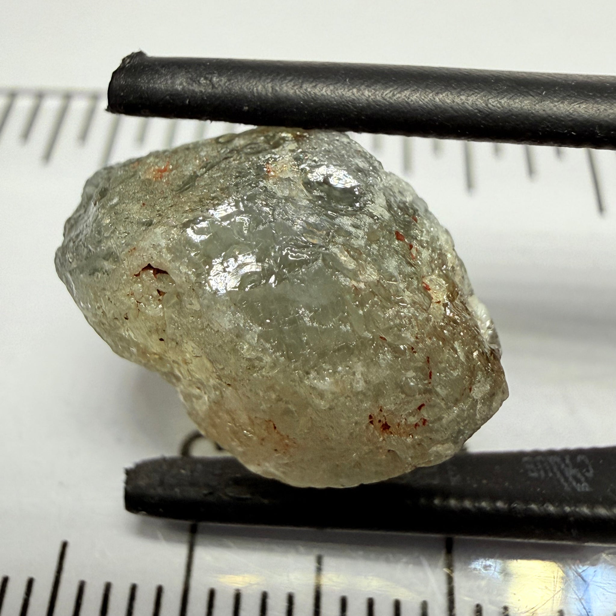 Umba Sapphire, 14.72ct, Umba Valley, Tanzania, Untreated Unheated. Slightly to moderately included,  slight silk, crack going a 1/4 way in. See the backlit pics  I have circled the crack, minor fissures to be removed before faceting
