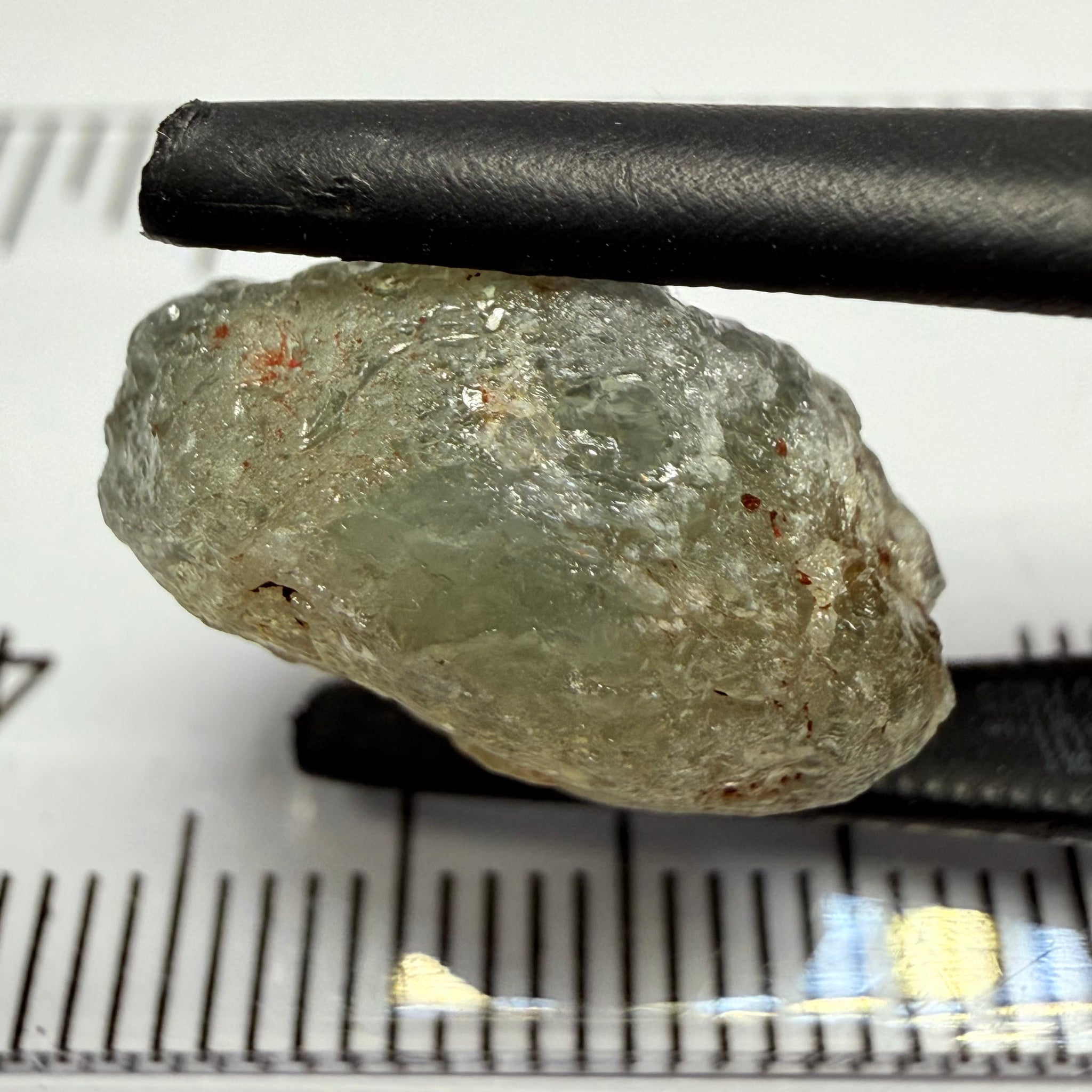 Umba Sapphire, 14.72ct, Umba Valley, Tanzania, Untreated Unheated. Slightly to moderately included,  slight silk, crack going a 1/4 way in. See the backlit pics  I have circled the crack, minor fissures to be removed before faceting