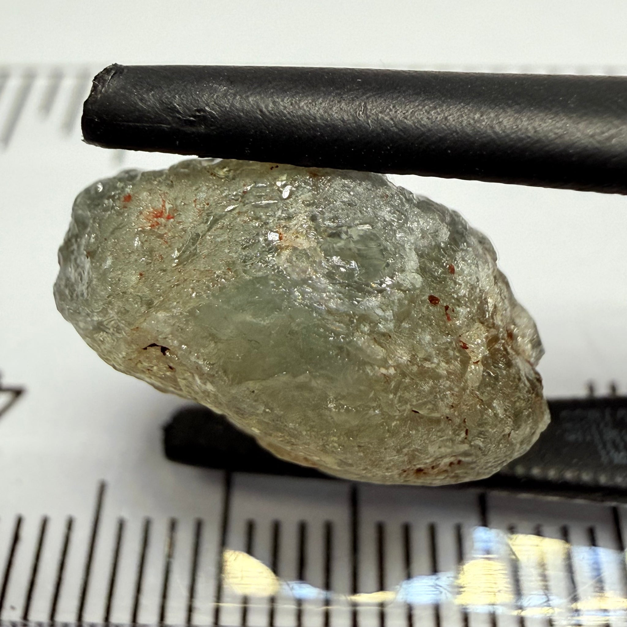 Umba Sapphire, 14.72ct, Umba Valley, Tanzania, Untreated Unheated. Slightly to moderately included,  slight silk, crack going a 1/4 way in. See the backlit pics  I have circled the crack, minor fissures to be removed before faceting