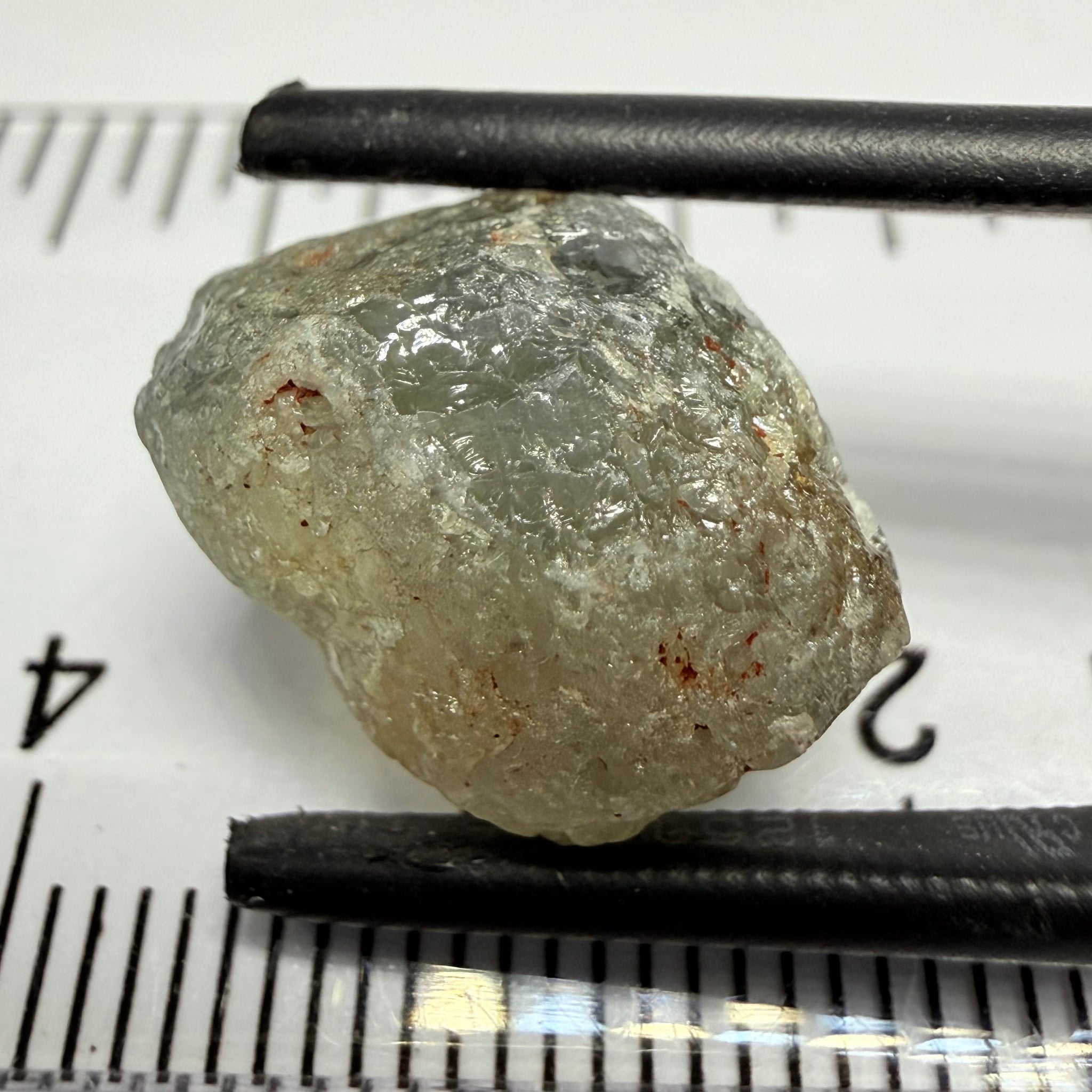 Umba Sapphire, 14.72ct, Umba Valley, Tanzania, Untreated Unheated. Slightly to moderately included,  slight silk, crack going a 1/4 way in. See the backlit pics  I have circled the crack, minor fissures to be removed before faceting