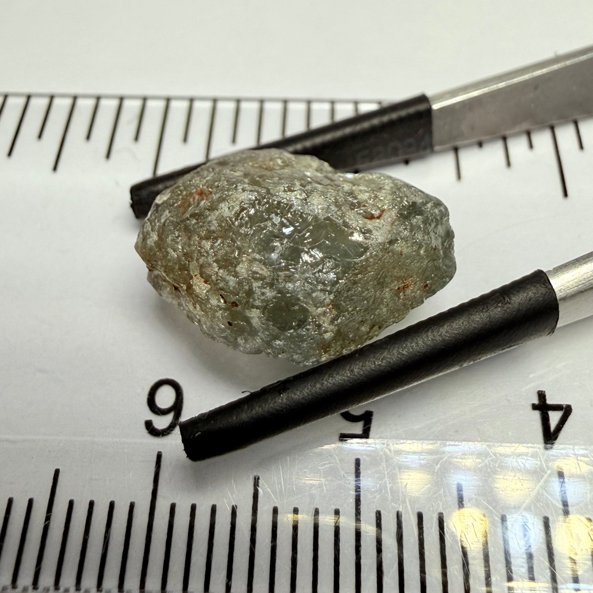 Umba Sapphire, 14.72ct, Umba Valley, Tanzania, Untreated Unheated. Slightly to moderately included,  slight silk, crack going a 1/4 way in. See the backlit pics  I have circled the crack, minor fissures to be removed before faceting