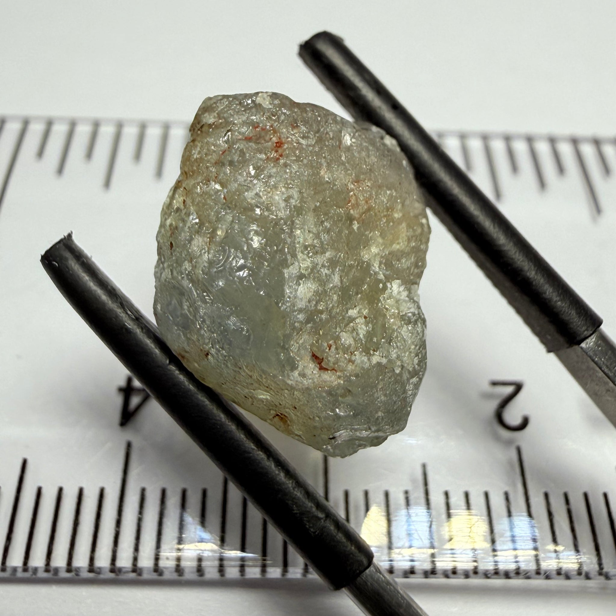 Umba Sapphire, 14.72ct, Umba Valley, Tanzania, Untreated Unheated. Slightly to moderately included,  slight silk, crack going a 1/4 way in. See the backlit pics  I have circled the crack, minor fissures to be removed before faceting