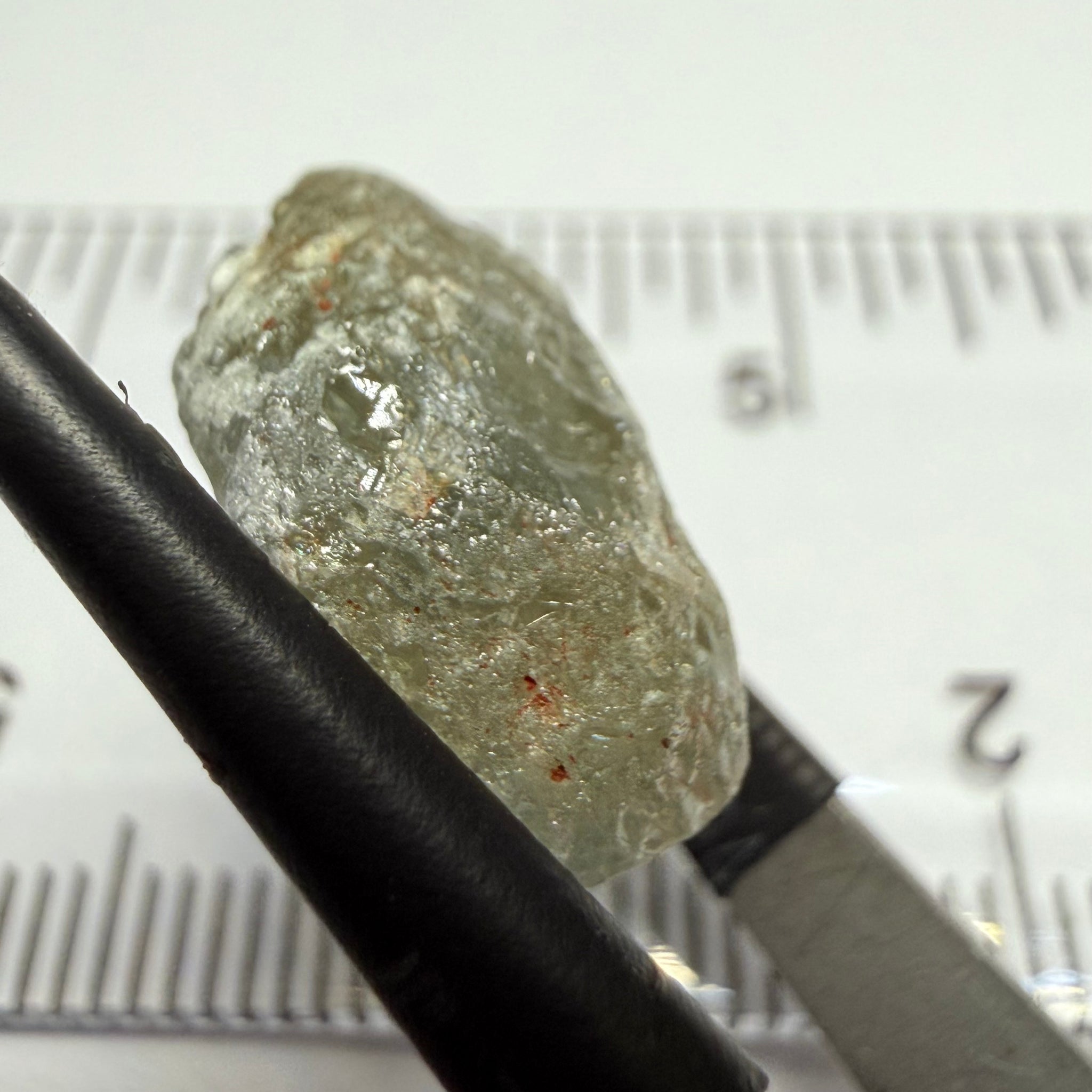 Umba Sapphire, 14.72ct, Umba Valley, Tanzania, Untreated Unheated. Slightly to moderately included,  slight silk, crack going a 1/4 way in. See the backlit pics  I have circled the crack, minor fissures to be removed before faceting