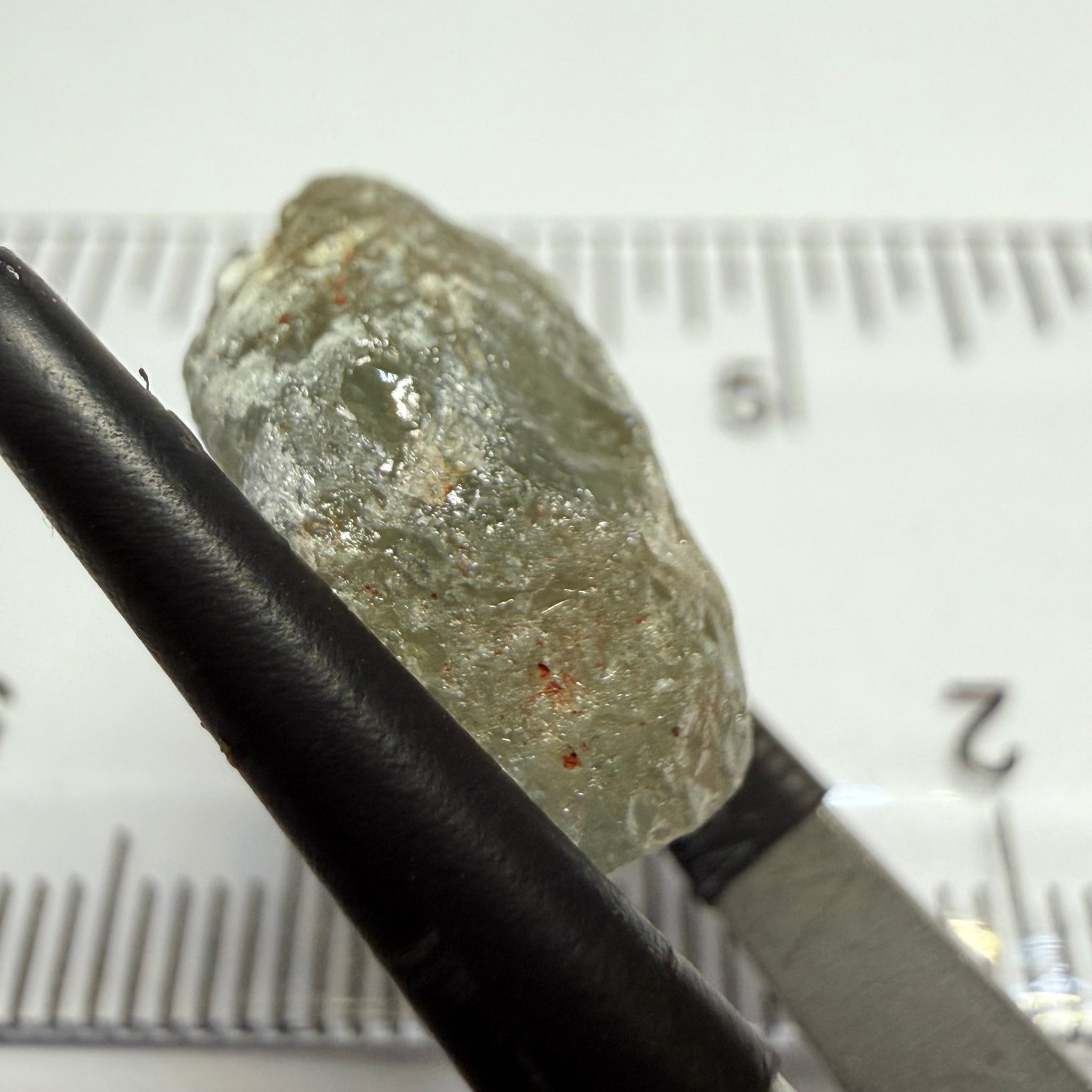 Umba Sapphire, 14.72ct, Umba Valley, Tanzania, Untreated Unheated. Slightly to moderately included,  slight silk, crack going a 1/4 way in. See the backlit pics  I have circled the crack, minor fissures to be removed before faceting
