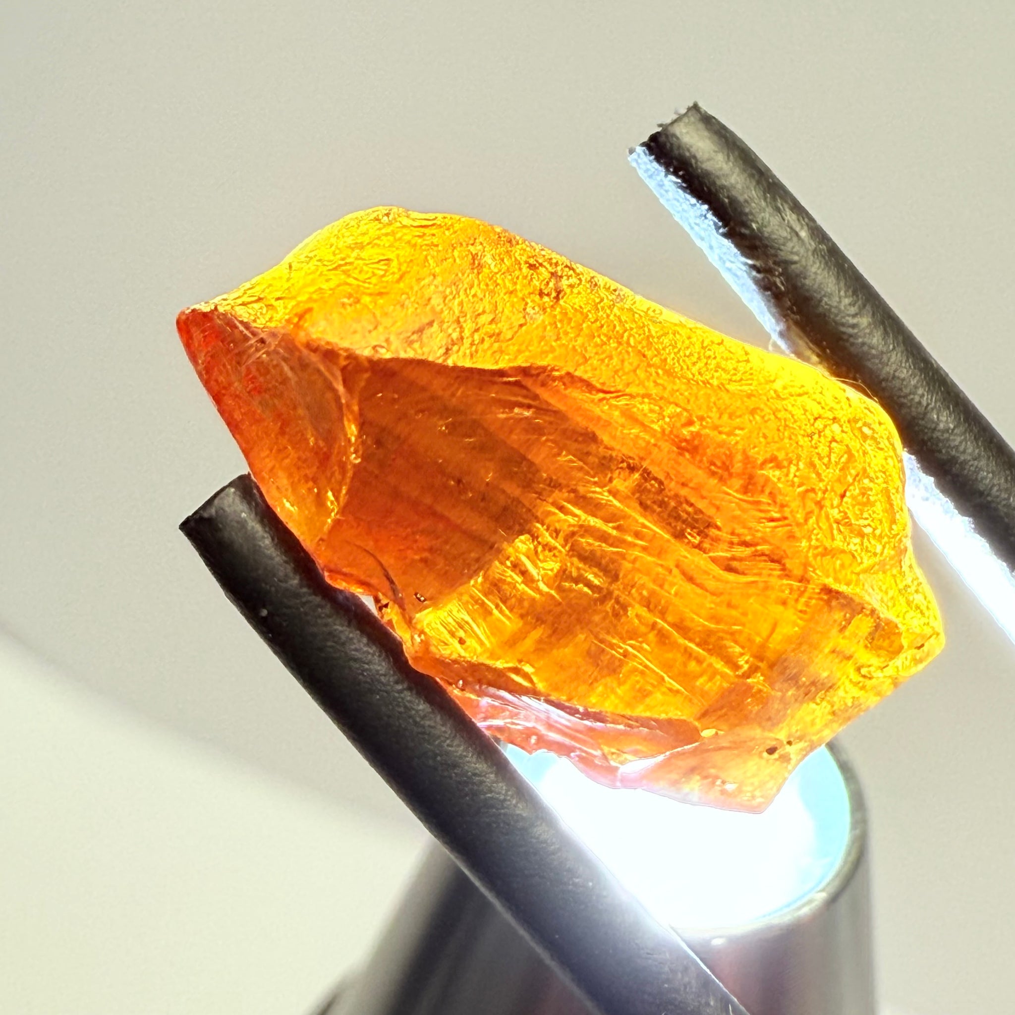 Malaya Garnet, 12.25ct, Super rare size, Tanzania, Untreated Unheated. Just faint parallel silk lines, I have backlit some photos so you can see the silk cannot be seen by the naked eye, very vivid bright colour