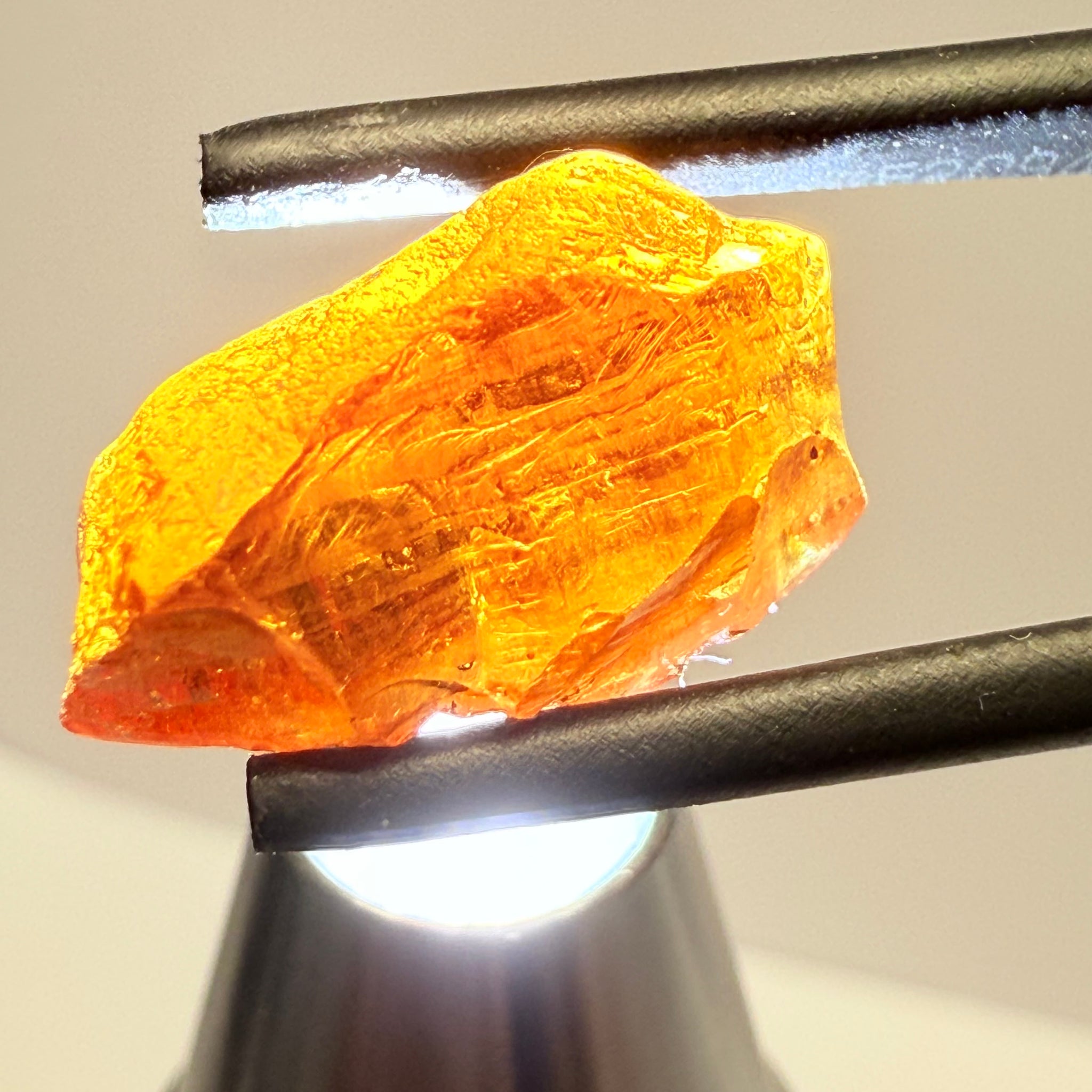 Malaya Garnet, 12.25ct, Super rare size, Tanzania, Untreated Unheated. Just faint parallel silk lines, I have backlit some photos so you can see the silk cannot be seen by the naked eye, very vivid bright colour