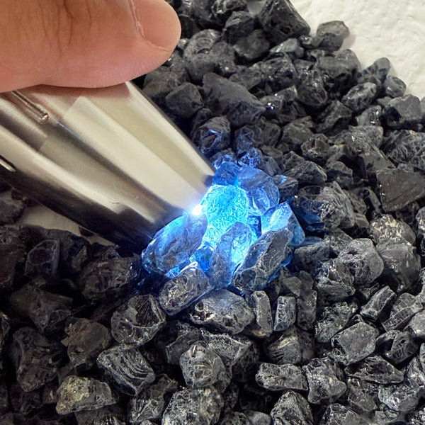 Midnight Blue Spinel Lot, 309.70gm / 1548.50ct, Mozambique, Untreated Unheated. All transparent stones, midnight blue but dark in normal light. See both videos. Almost all are vvs. Not sure if heat will lighten it. 3ct-11ct