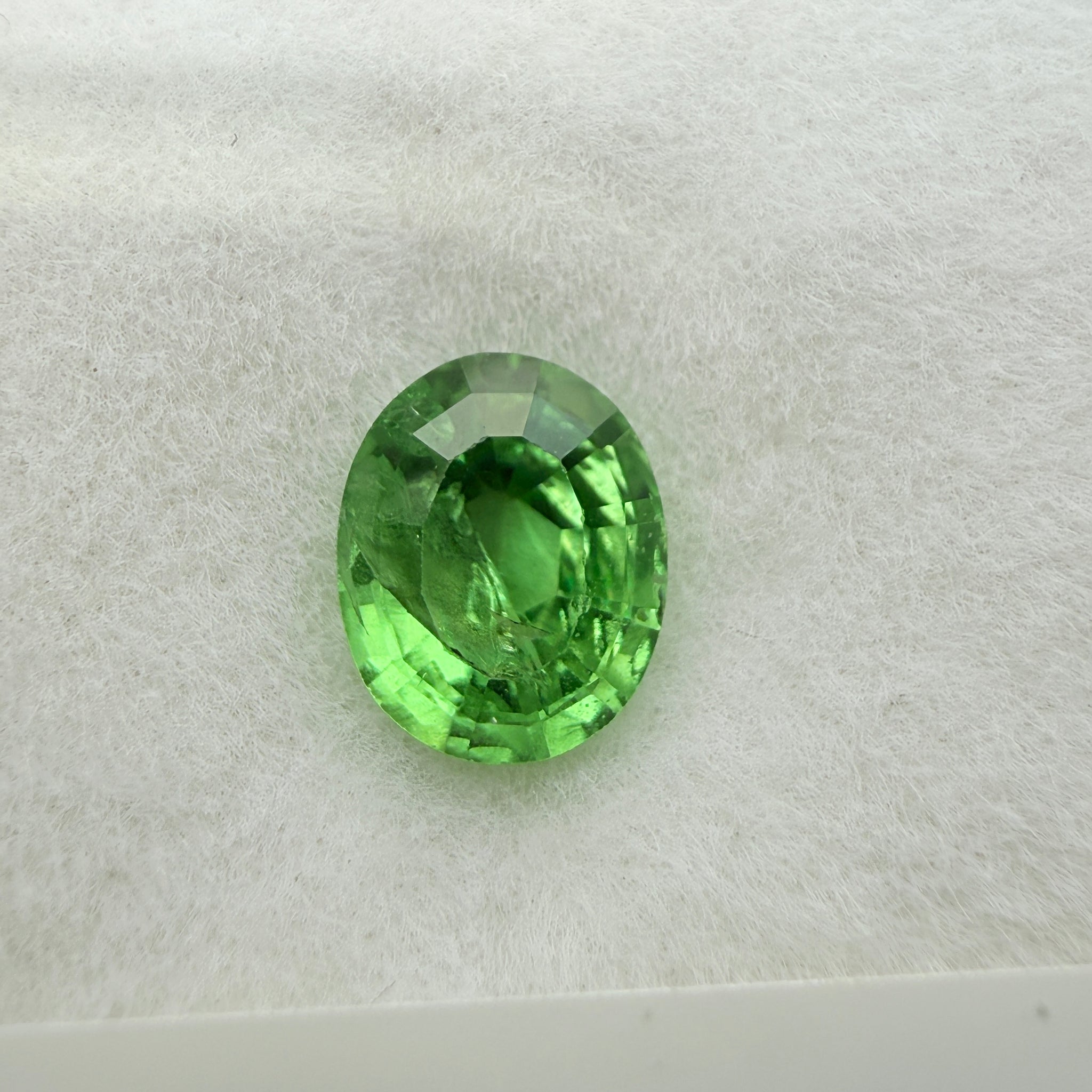 Tsavorite Garnet, 0.90ct, Kenya, Unheated Untreated, slight chip on crown facet, native cut.