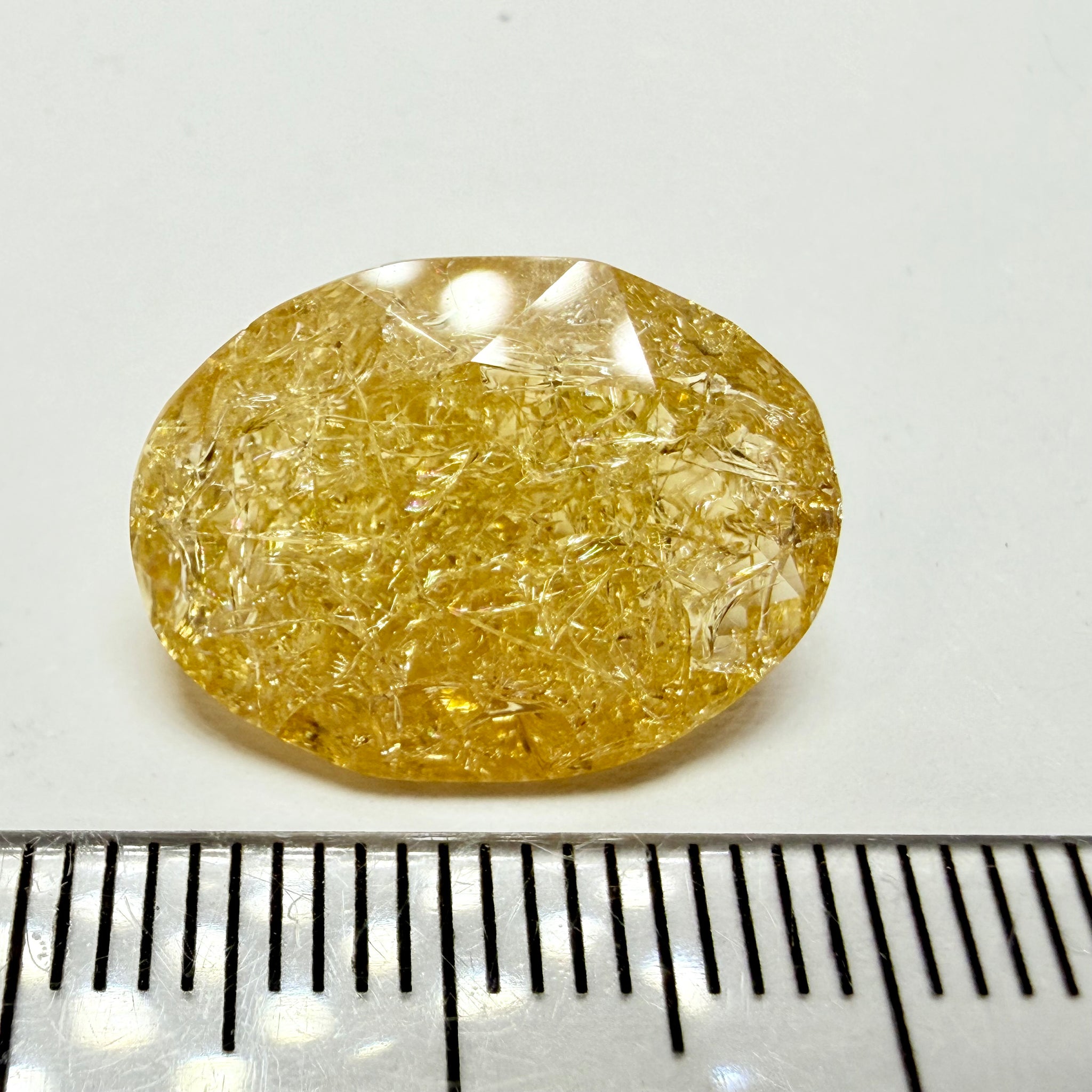 Ethiopian Opal that we cut 17 years ago and fractured internally, seems stable and none of the facets have broken, we thought it was quite pretty, from the initial Ethiopian Opal deposit, 6.87ct, Ethiopia, Untreated Unheated