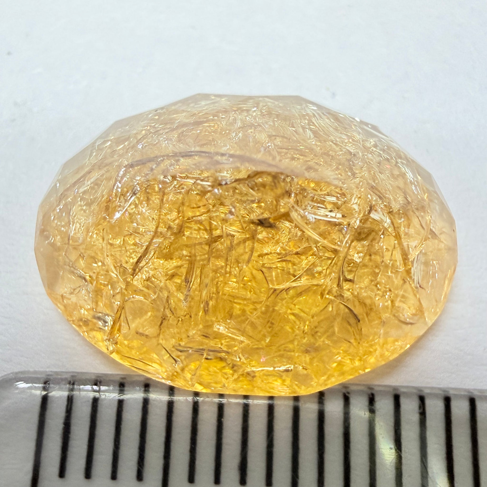 Ethiopian Opal that we cut 17 years ago and fractured internally, seems stable and none of the facets have broken, we thought it was quite pretty, from the initial Ethiopian Opal deposit, 6.87ct, Ethiopia, Untreated Unheated