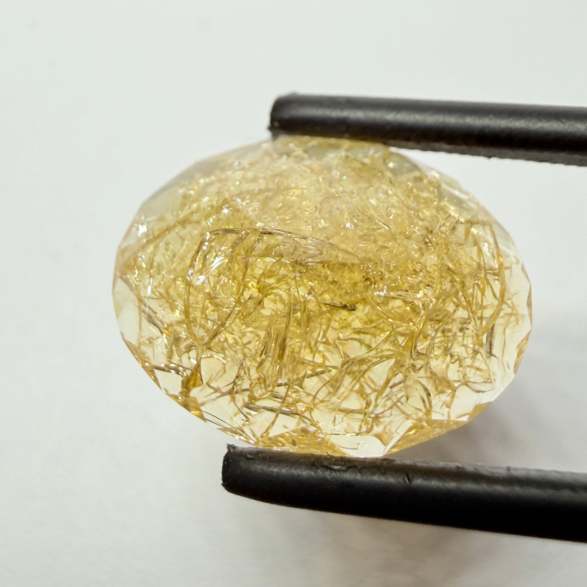 Ethiopian Opal that we cut 17 years ago and fractured internally, seems stable and none of the facets have broken, we thought it was quite pretty, from the initial Ethiopian Opal deposit, 6.87ct, Ethiopia, Untreated Unheated