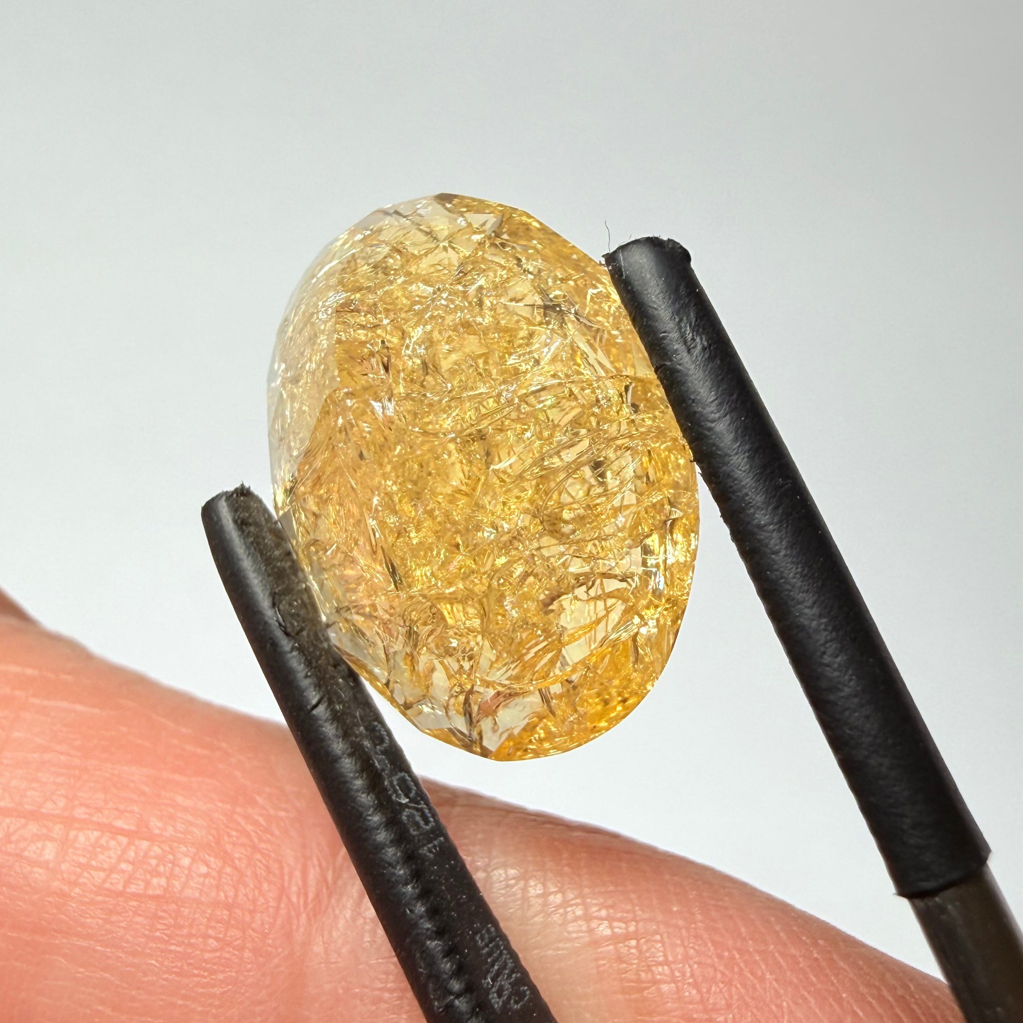 Ethiopian Opal that we cut 17 years ago and fractured internally, seems stable and none of the facets have broken, we thought it was quite pretty, from the initial Ethiopian Opal deposit, 6.87ct, Ethiopia, Untreated Unheated