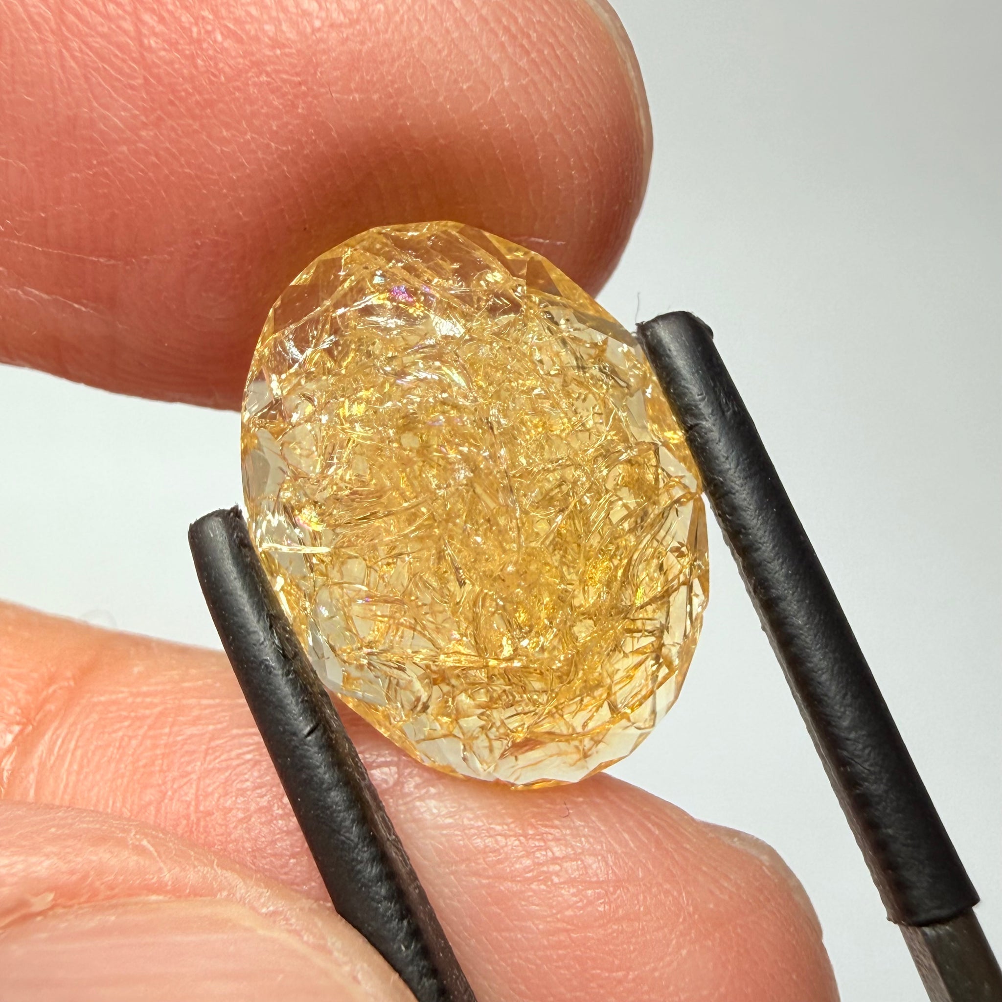 Ethiopian Opal that we cut 17 years ago and fractured internally, seems stable and none of the facets have broken, we thought it was quite pretty, from the initial Ethiopian Opal deposit, 6.87ct, Ethiopia, Untreated Unheated